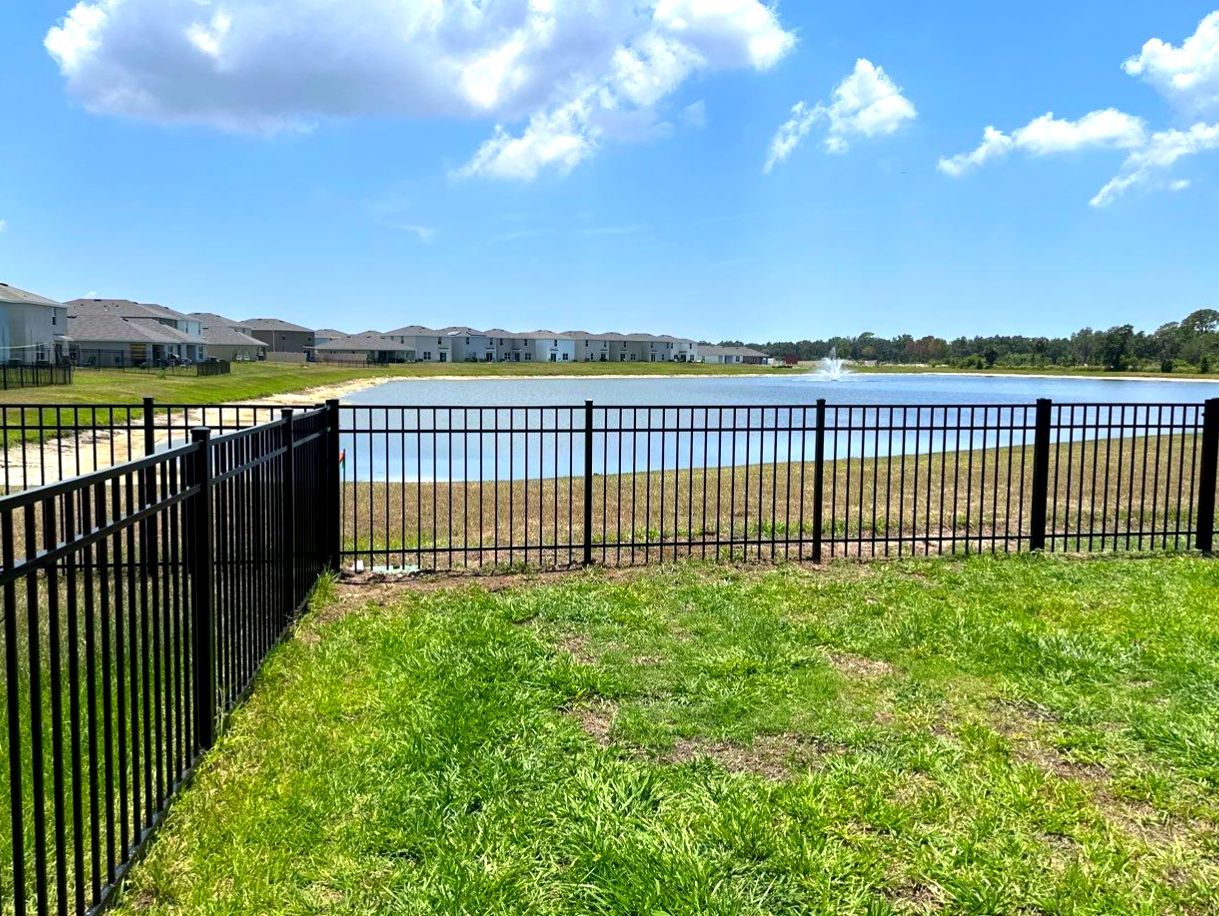 Aluminum Fence Installation using Black 3 Rail Aluminum Fence and Tan Vinyl Privacy Fence by Asap fence and gates, LLC
