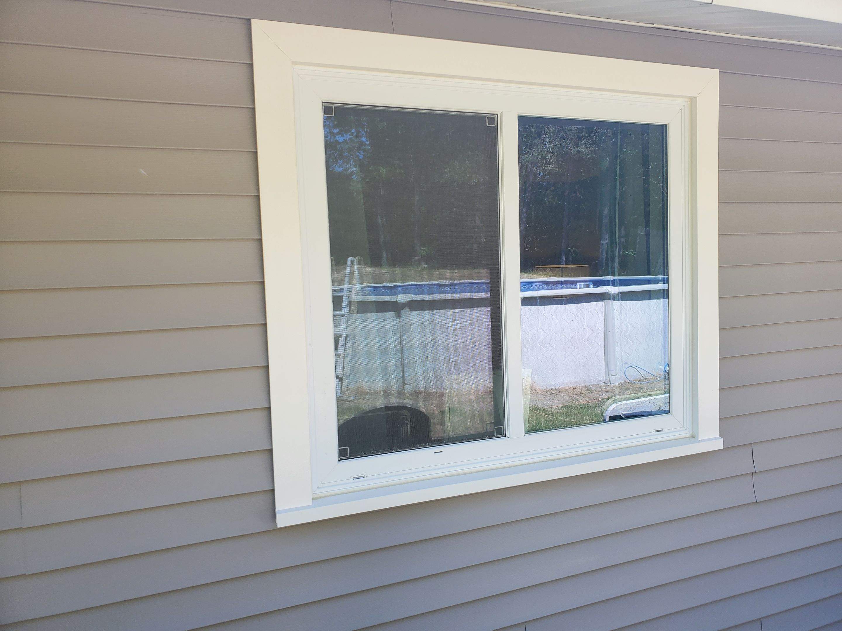 Siding Installation using insulation, PVC trim and vinyl siding by UBrothers Construction