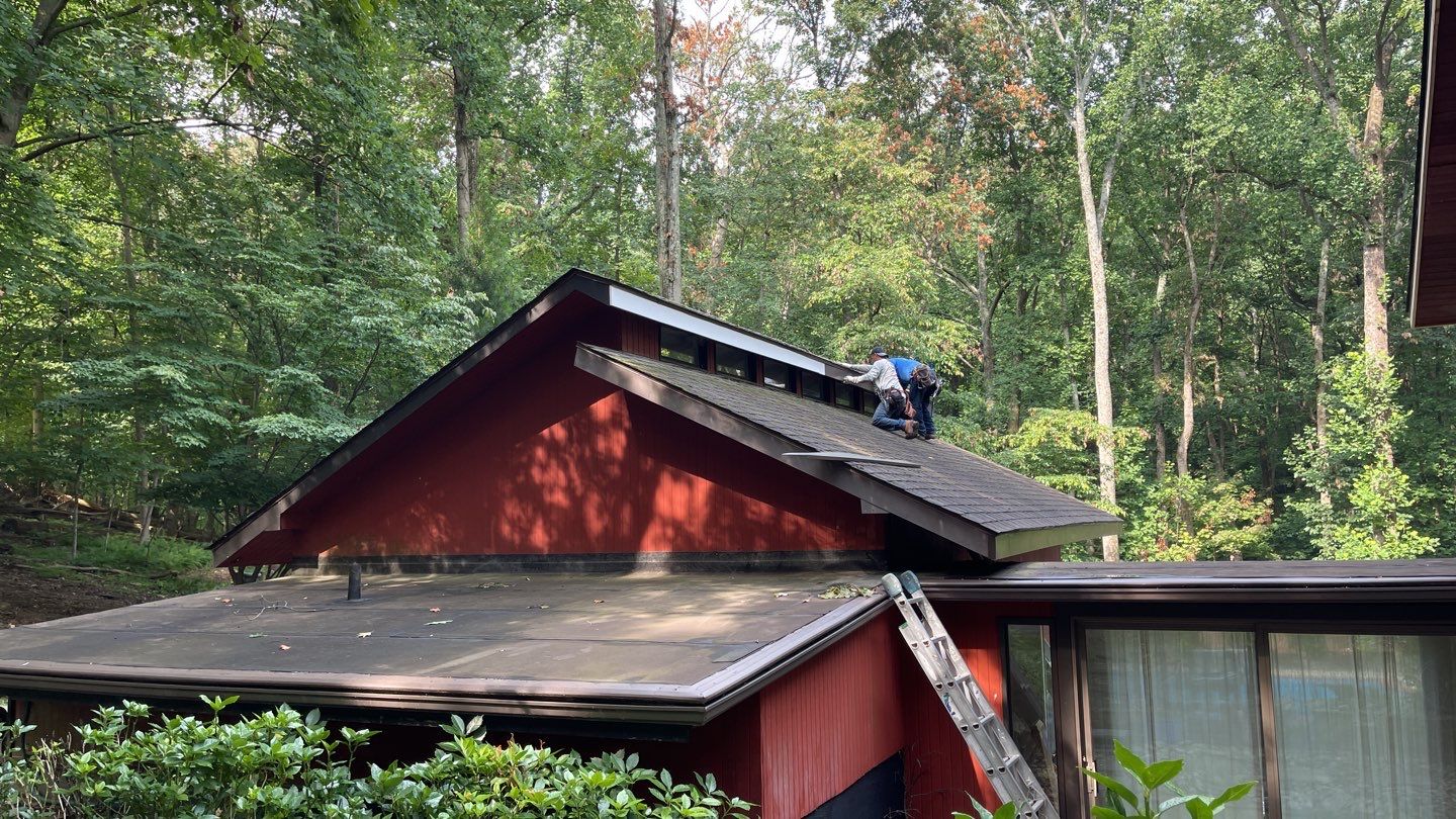 Deckhouse Roof Replacement by American Home Contractors