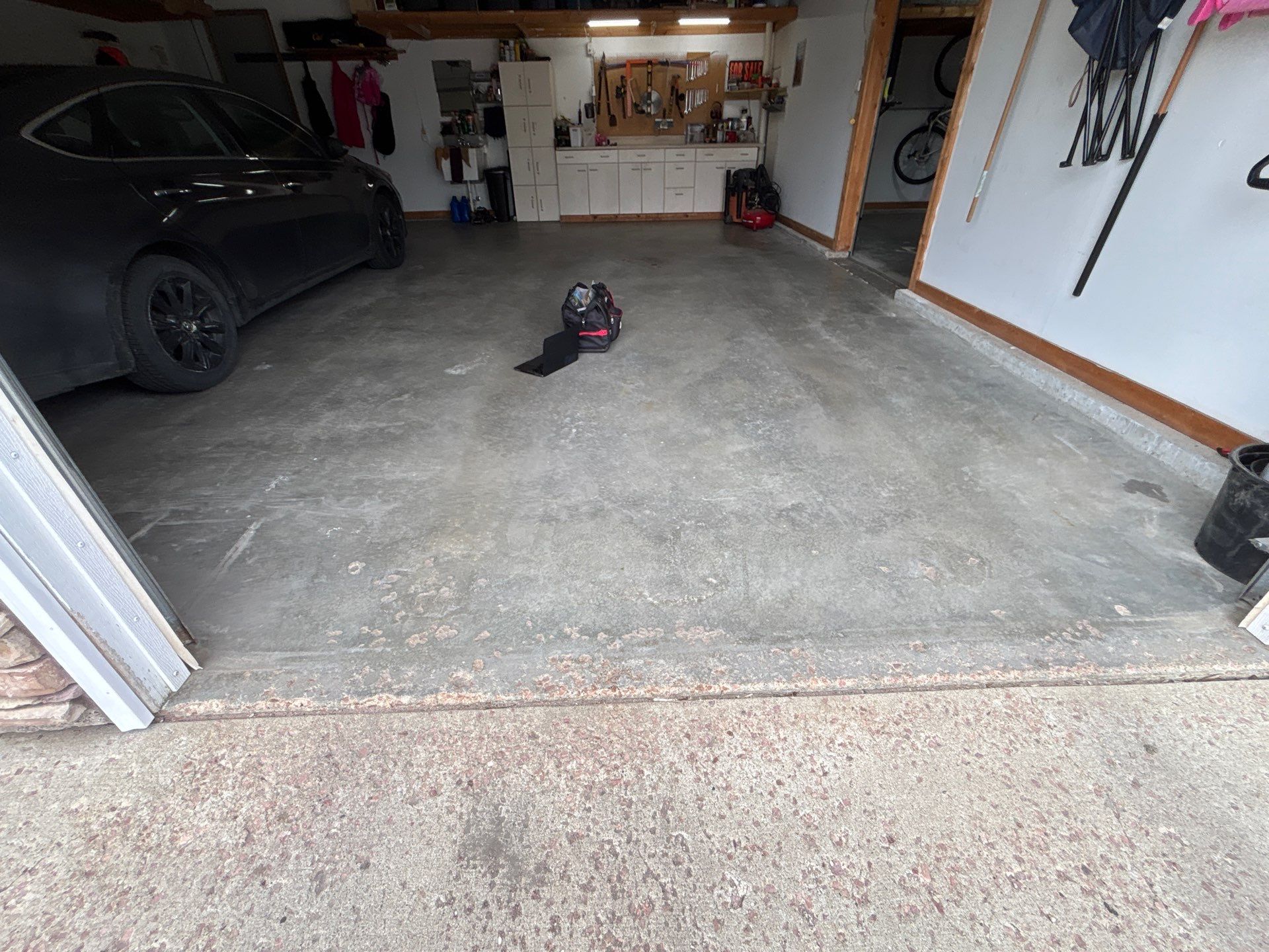 Gray and Black Speckled Polyurea Garage Floor in Dell Rapids by Select Painting, Coatings & Garage Cabinets