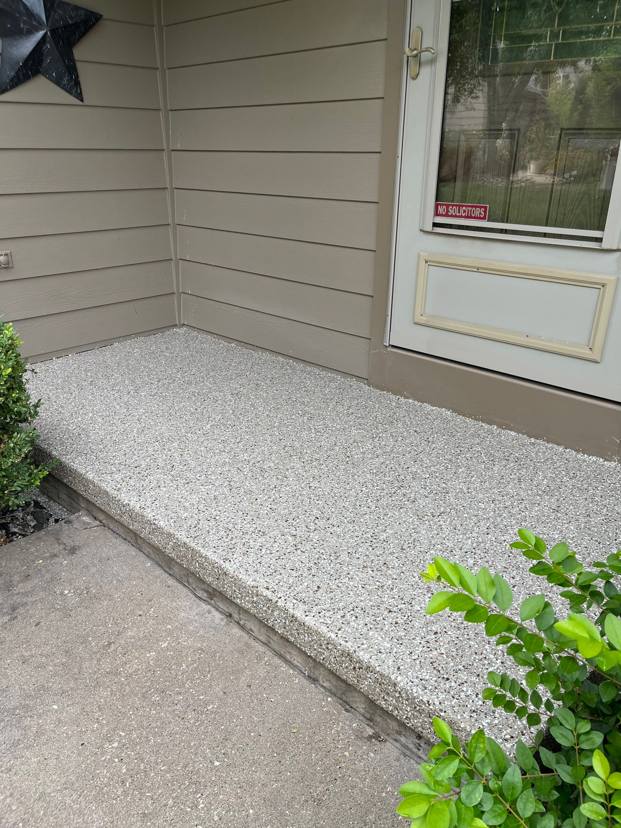 West Des Moines Garage and Patio Floor Coating using Pebble Beach Flakes by Revival Concrete Coatings