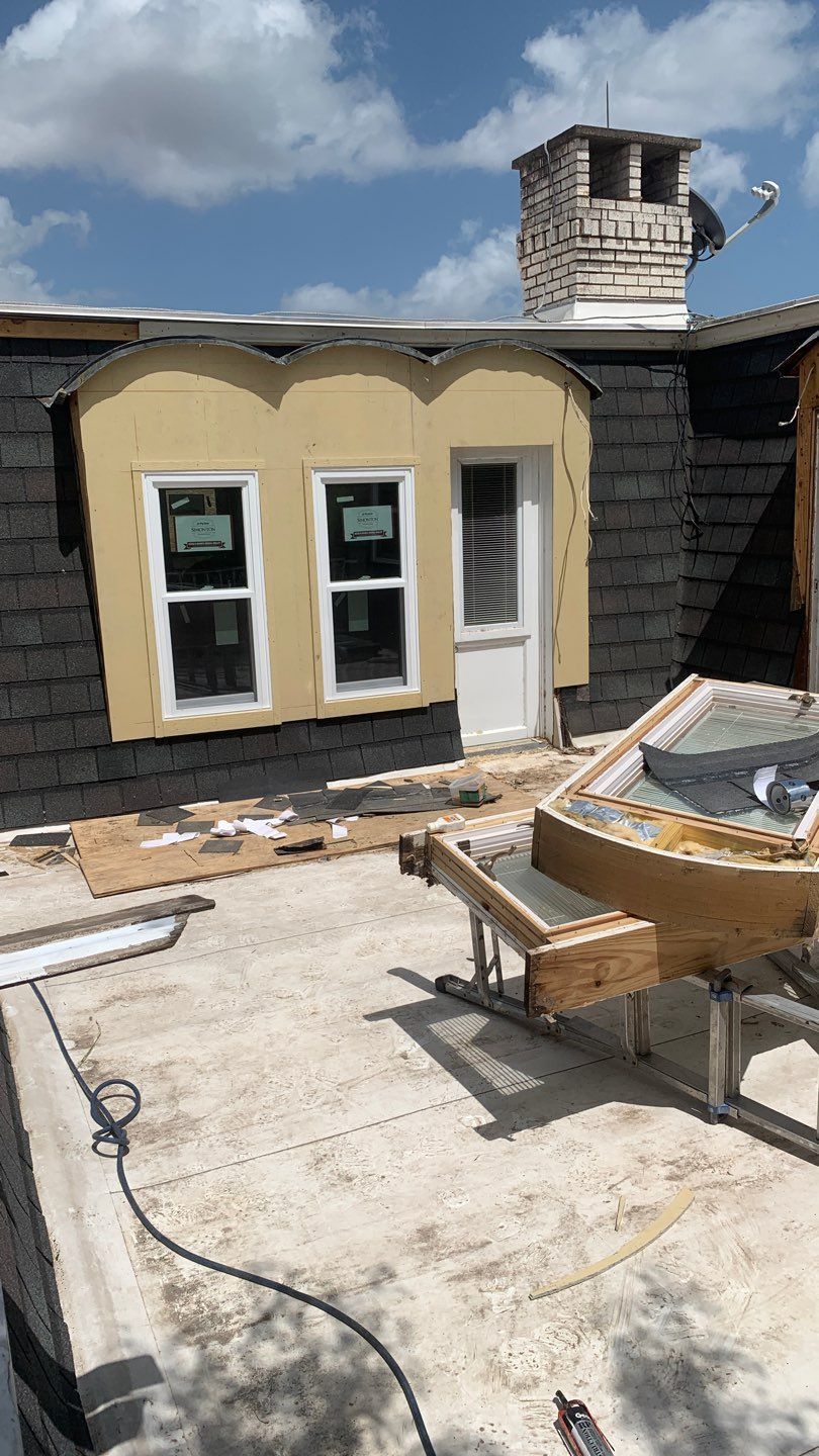 Mansard Charm by Bayfront Roofing and Construction
