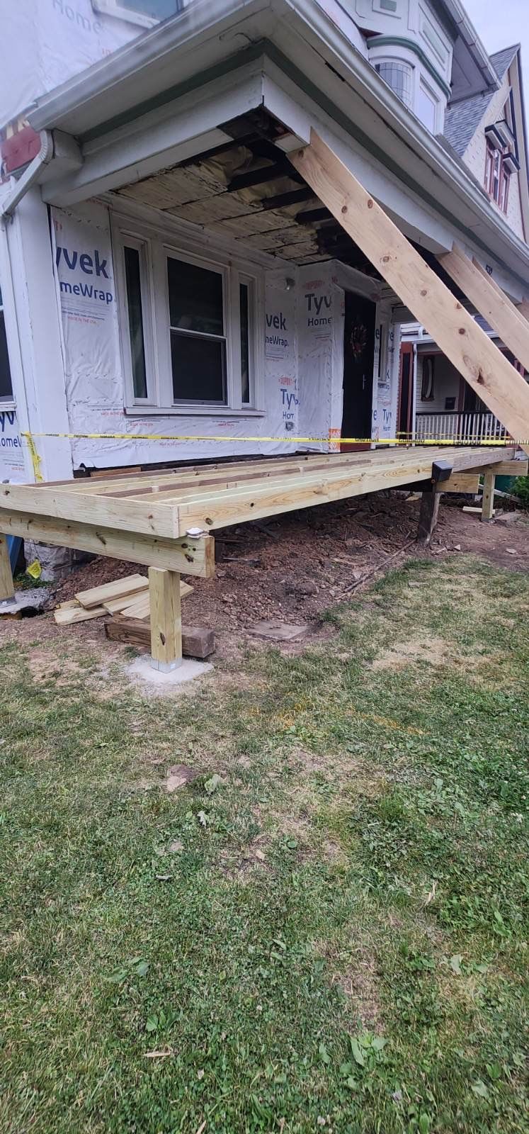 Exterior Renovations- Siding, Stamped Concrete, Porch, and Railings by Ivy Lea Construction