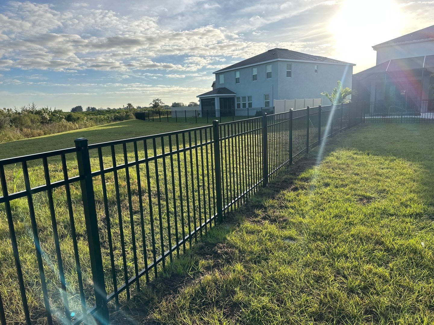 Vinyl Fence Installation using Vinyl Fence and a Black 3 Rail Aluminum Fence by Asap fence and gates, LLC
