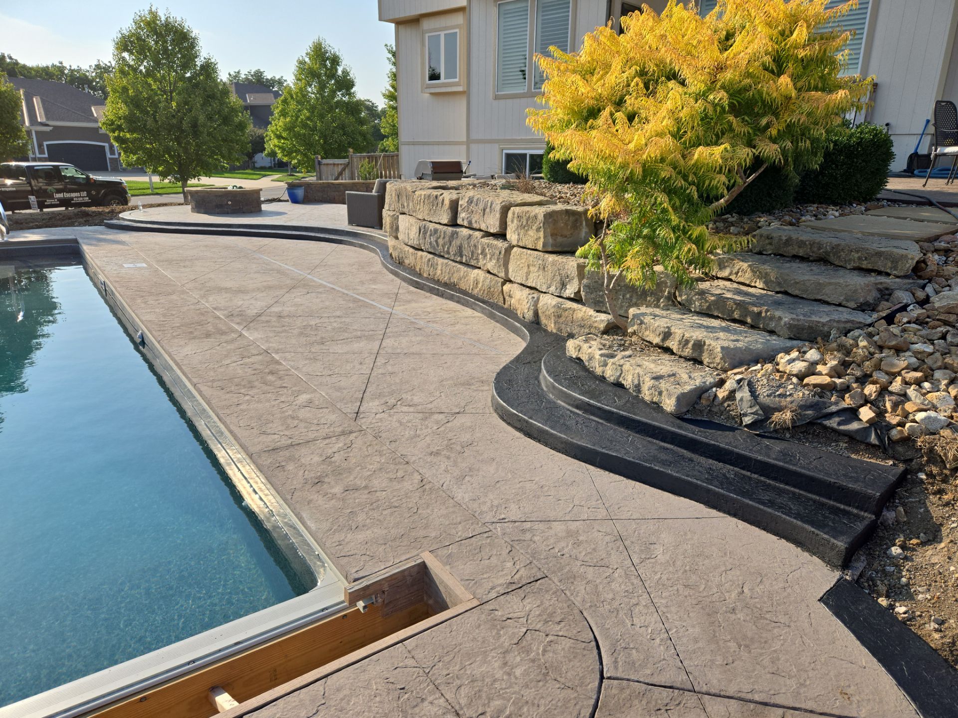 Back Yard Pool Patio by LAND ESCAPES LLC