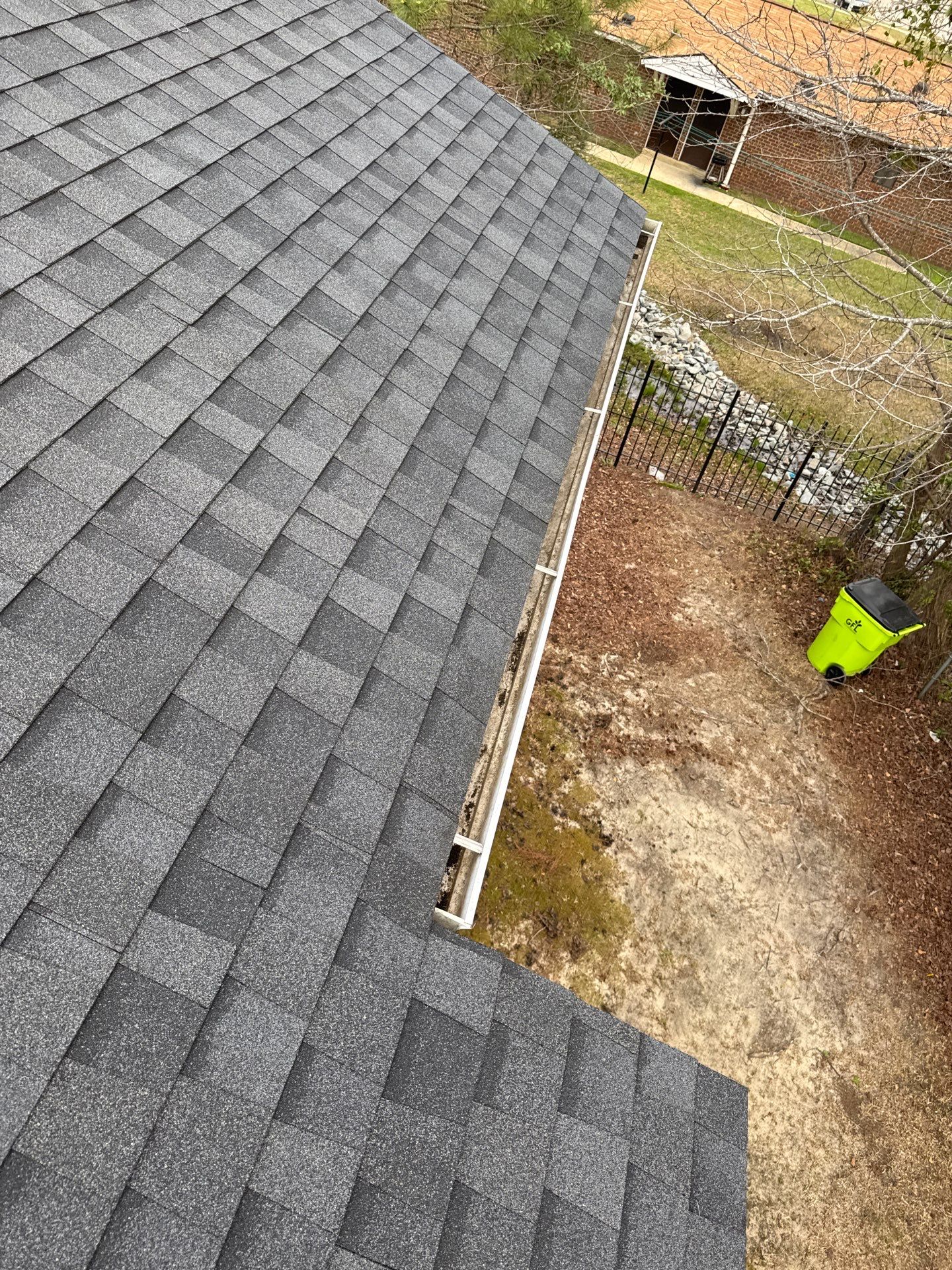 HOA gutter cleaning in Pinehurst & Southern Pines, NC, after  photo showing full gutters.