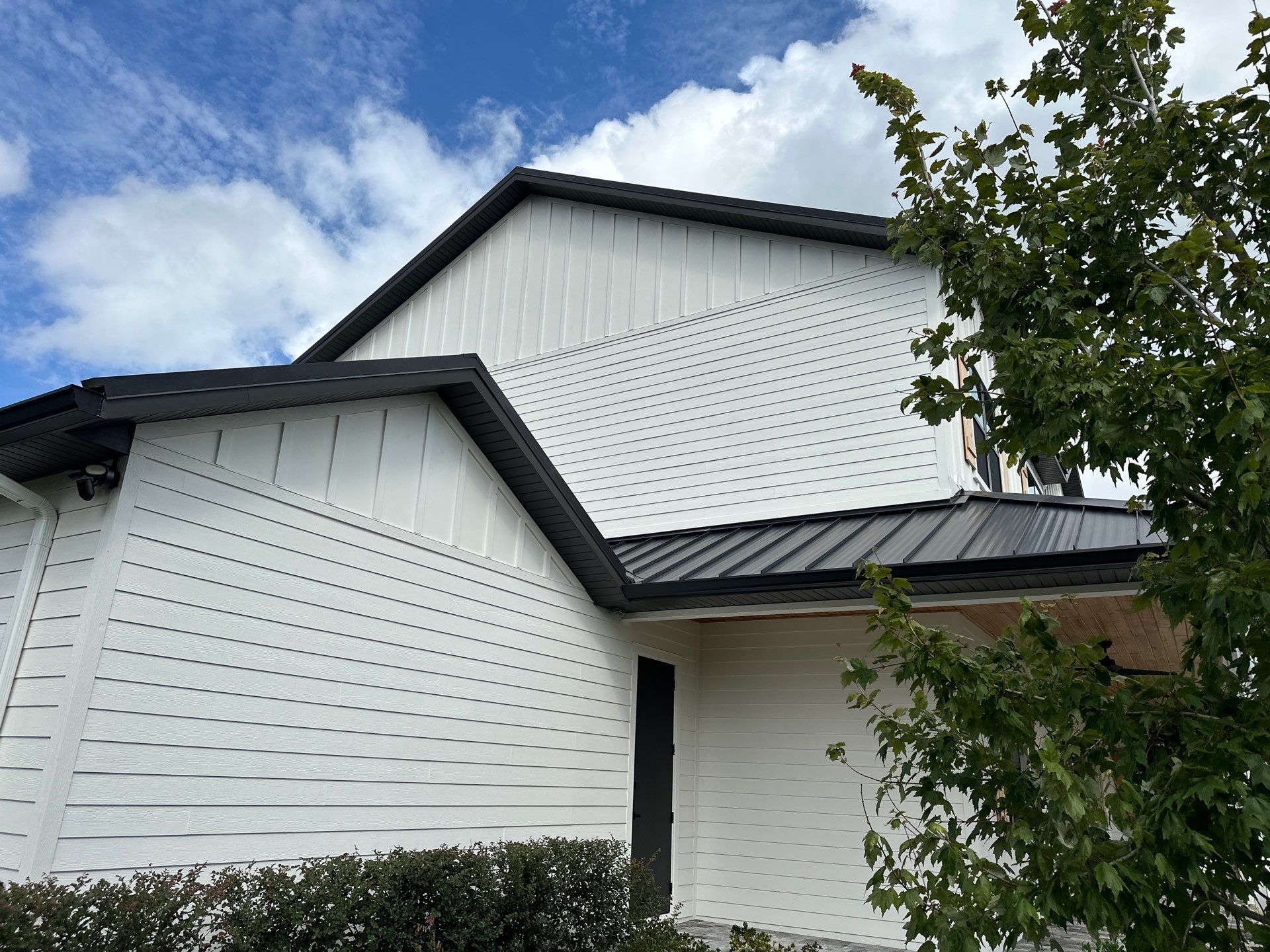 Complete Two-Story House Wash and Driveway Cleaning in Winding River Community, Bradenton, FL by Sunshine AquaWash