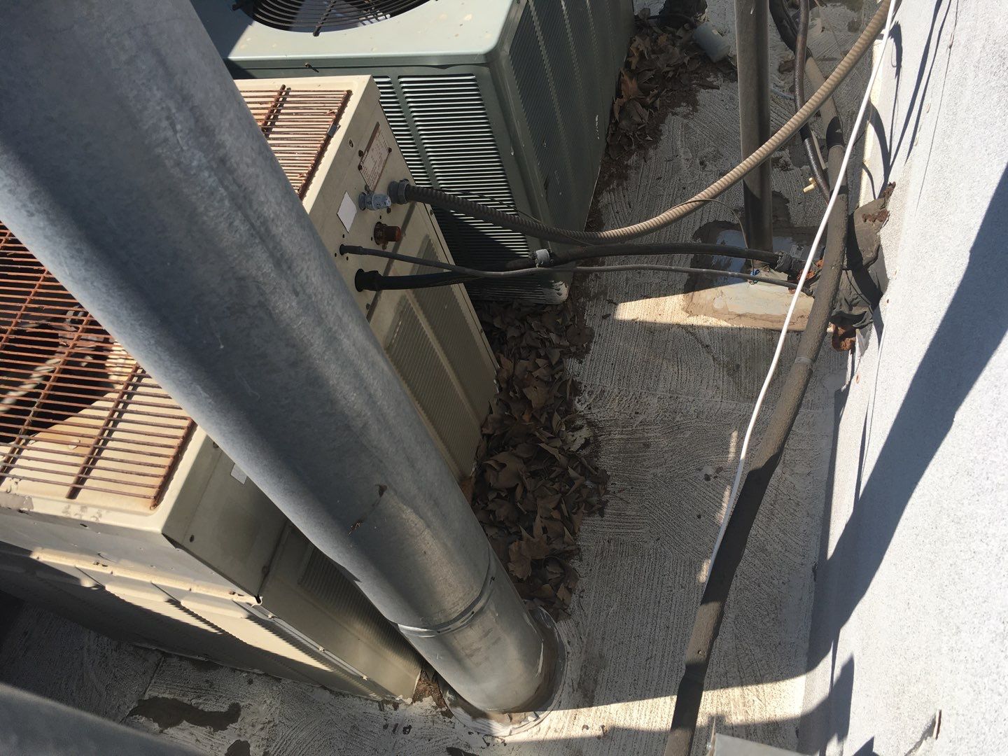 Spray foam and coatings inside commercial building HVAC well using Spray foam and coatings over existing BUR system by Straight Edge Roofing Inc