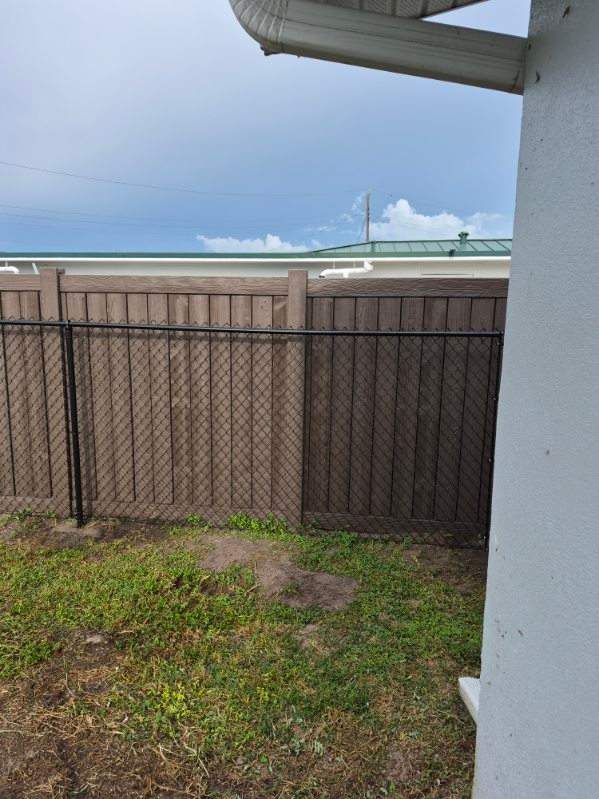 Black Chain Link Fence Installation for Residential Backyard in Port Charlotte by True Fence LLC