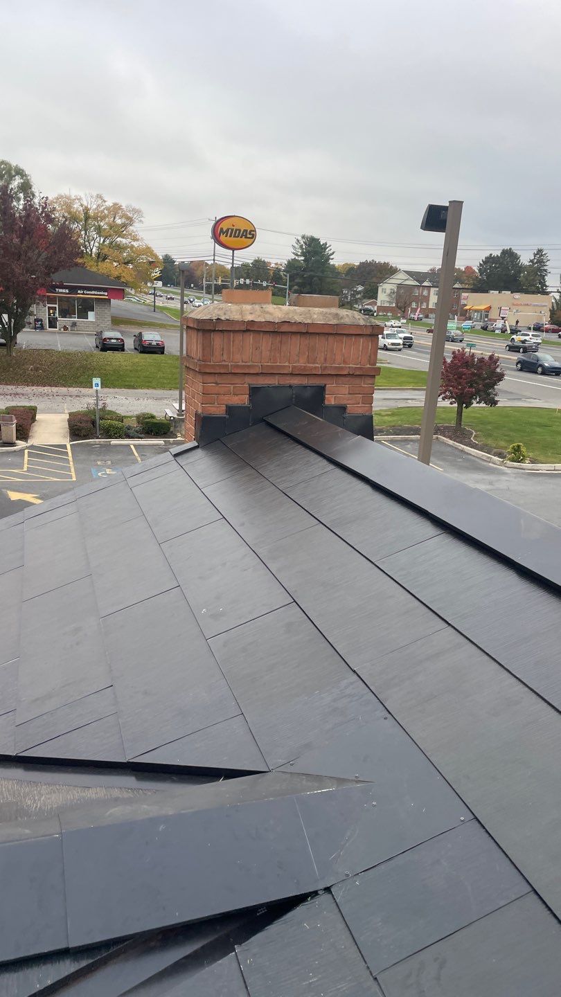 Tesla Solar Roof on a Commercial Building by American Home Contractors