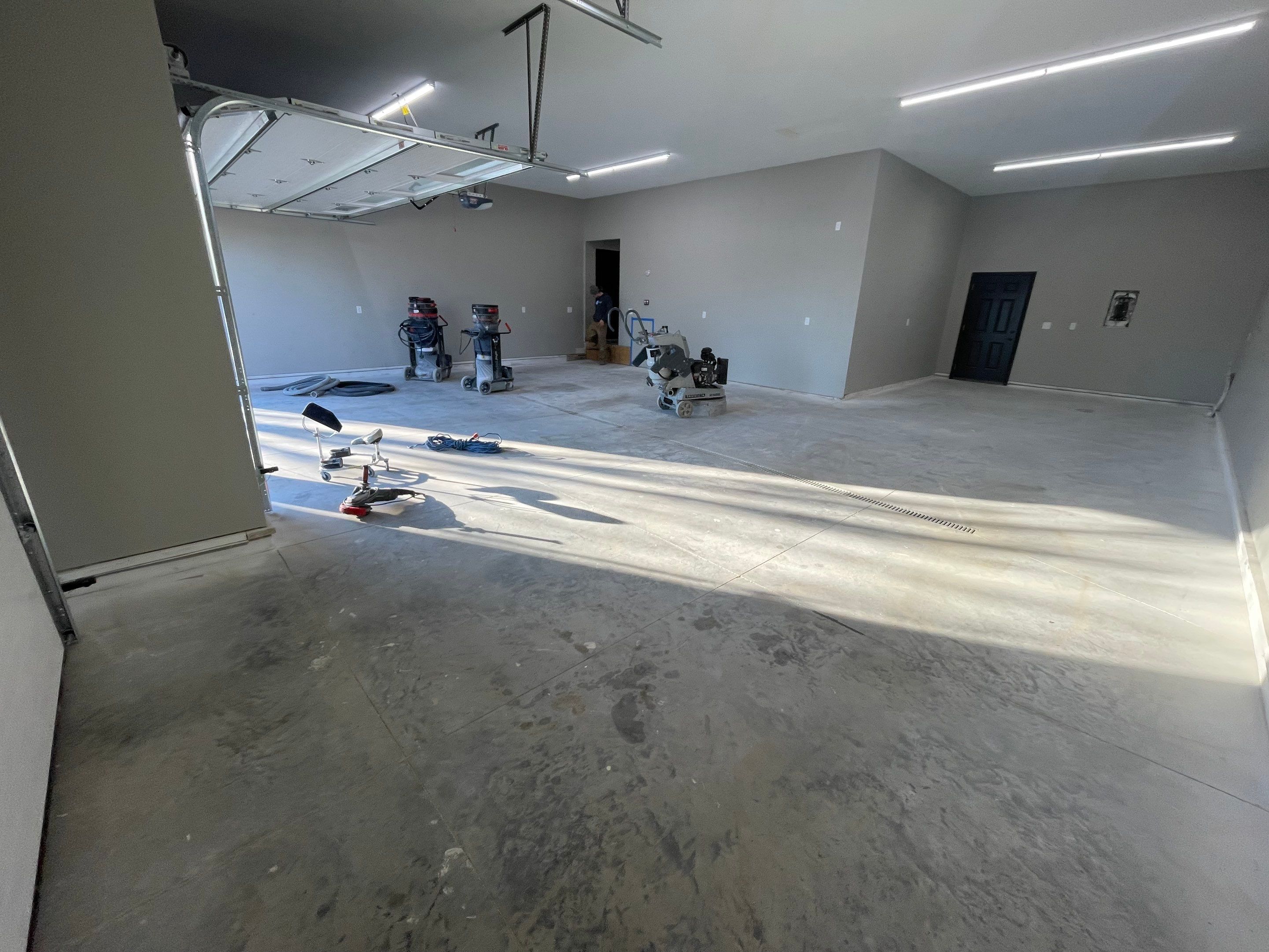 Decorative Flake Concrete Coating Installation in North Sioux City by Select Painting, Coatings & Garage Cabinets