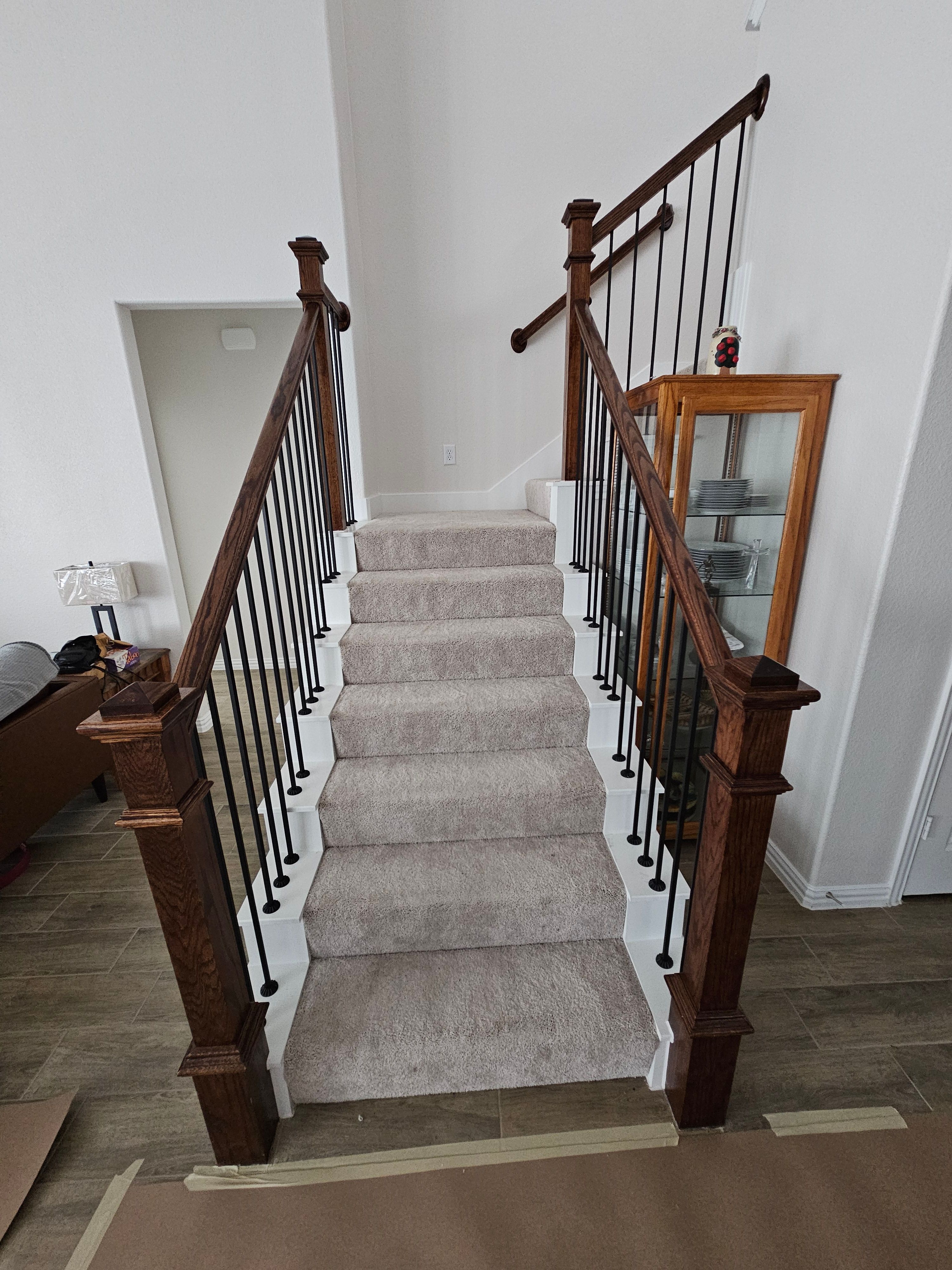 Carpet replacement with Tile and Red Oak Stairs by EL-GC LLC 