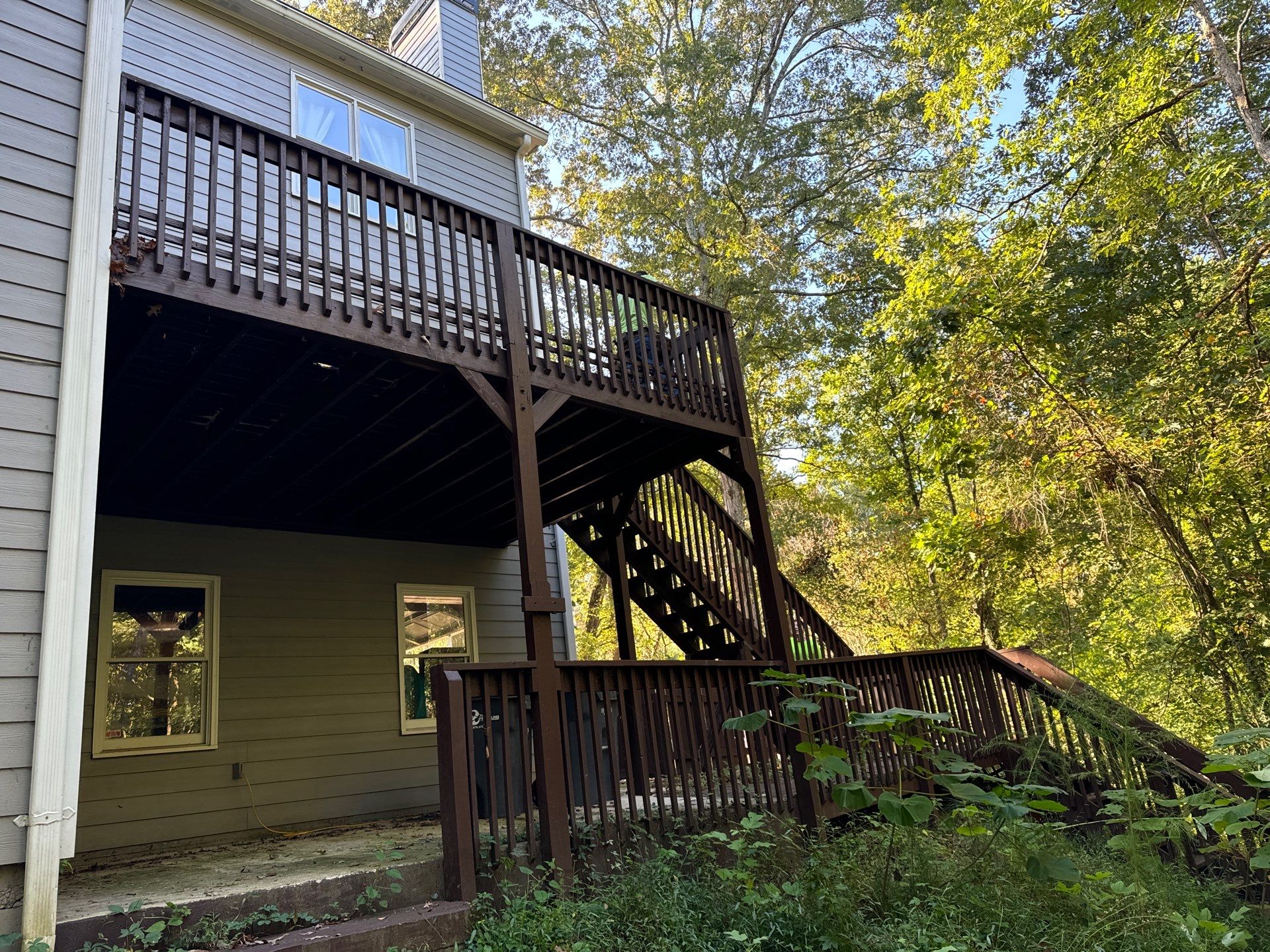 Elevated Deck Replacement with White Railings in Kennesaw by Swift Home Renovations 