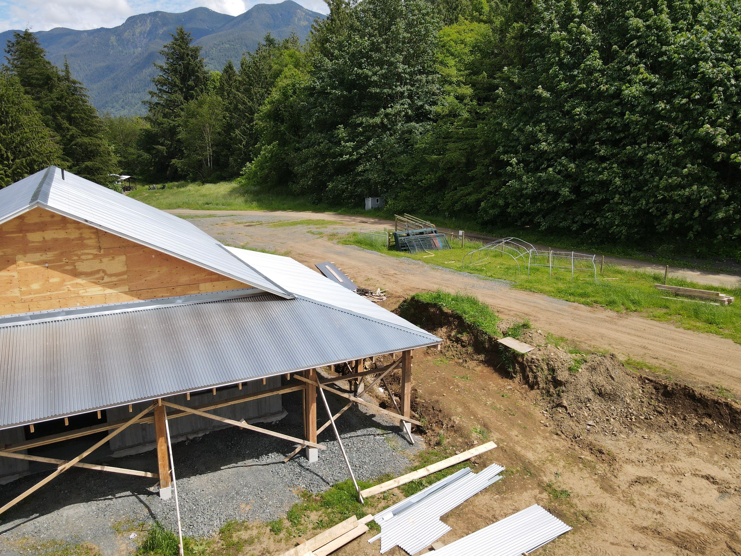 Commercial Roofing Installation using corrugated metal by Top Notch Roofing Inc
