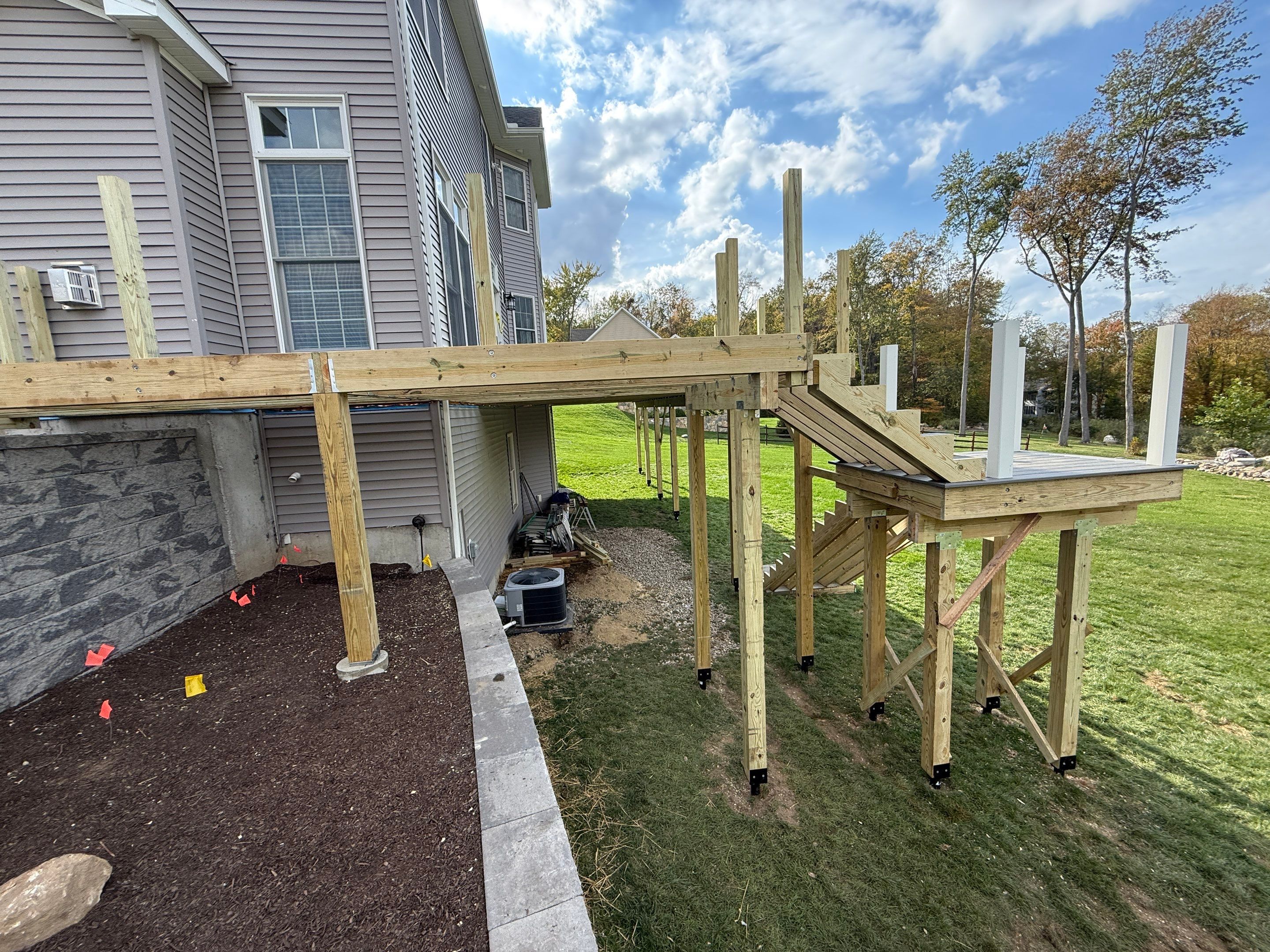 Deck replacement and expansion, With useable under space. Trex Tropical Island mist boards.  by DiGiorgi Roofing and Siding Inc