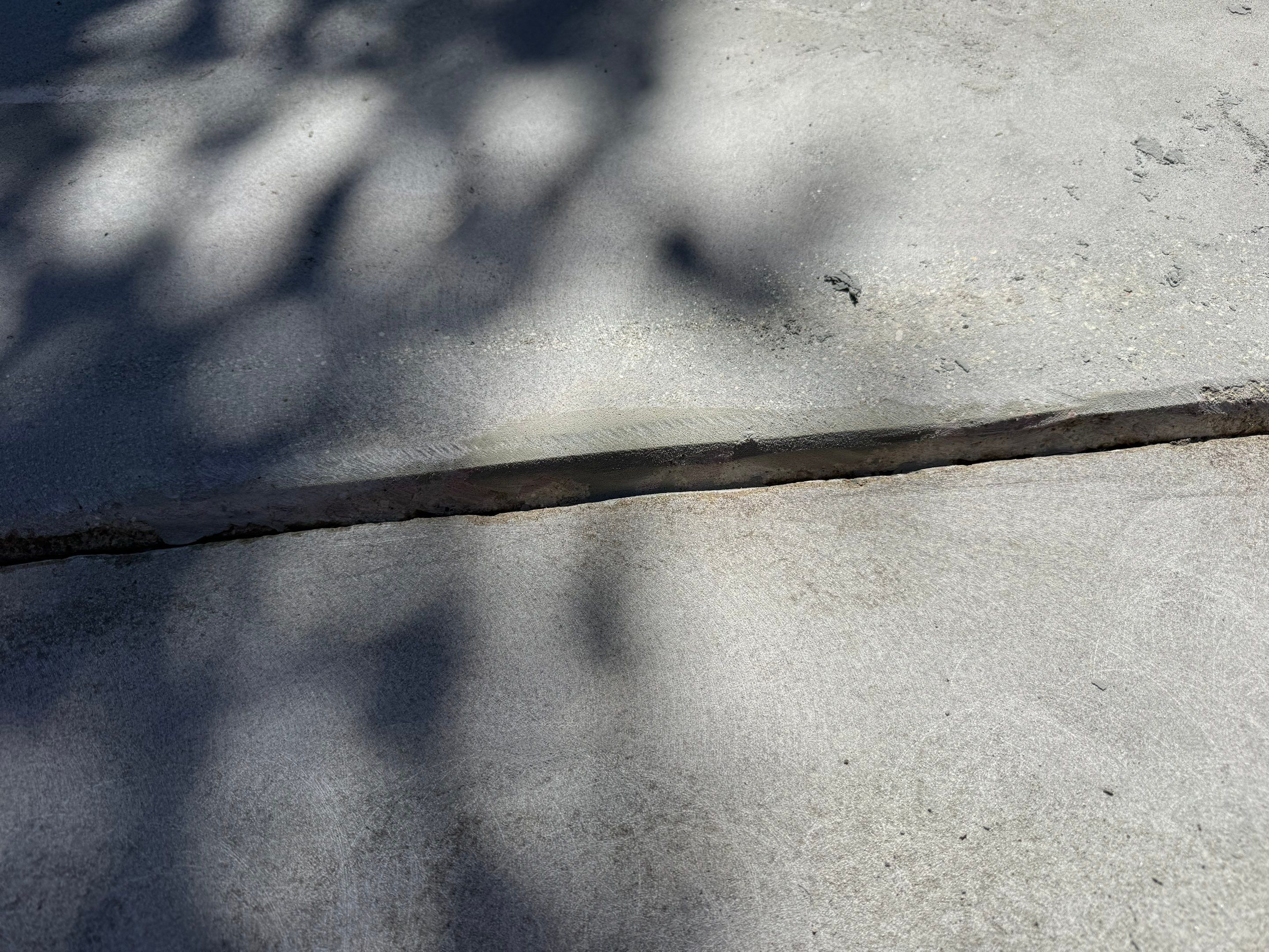 Textured Concrete Coating and Paver Patio Refresh in Sioux Falls by Select Painting, Coatings & Garage Cabinets