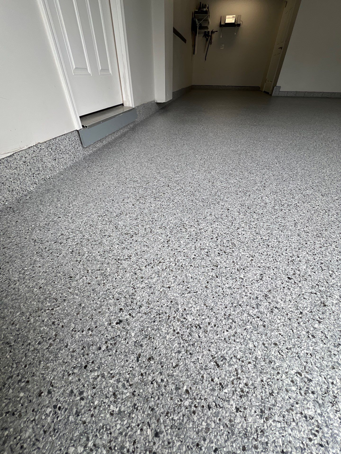 Silverado garage floor coating  by NG Masonry & Construction LLC