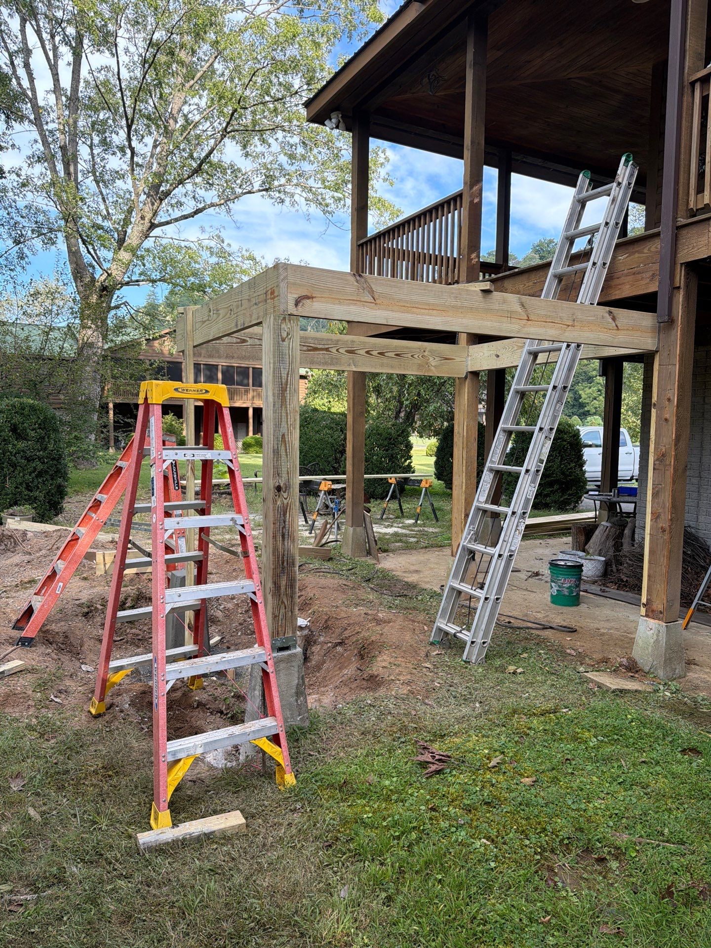Log Cabin Wrap-Around Deck and External Staircase Installation in Caldwell by Walnut Hollow Decks & Outdoor Living