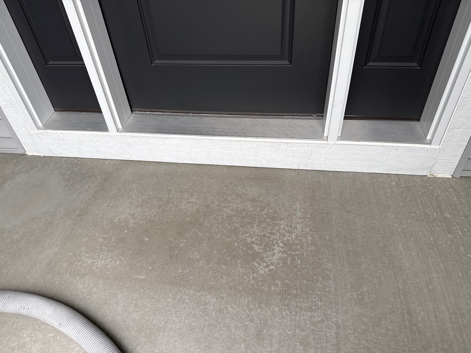 Gravel Flake Garage and Patio Floor Coating for Boone Residence by Revival Concrete Coatings