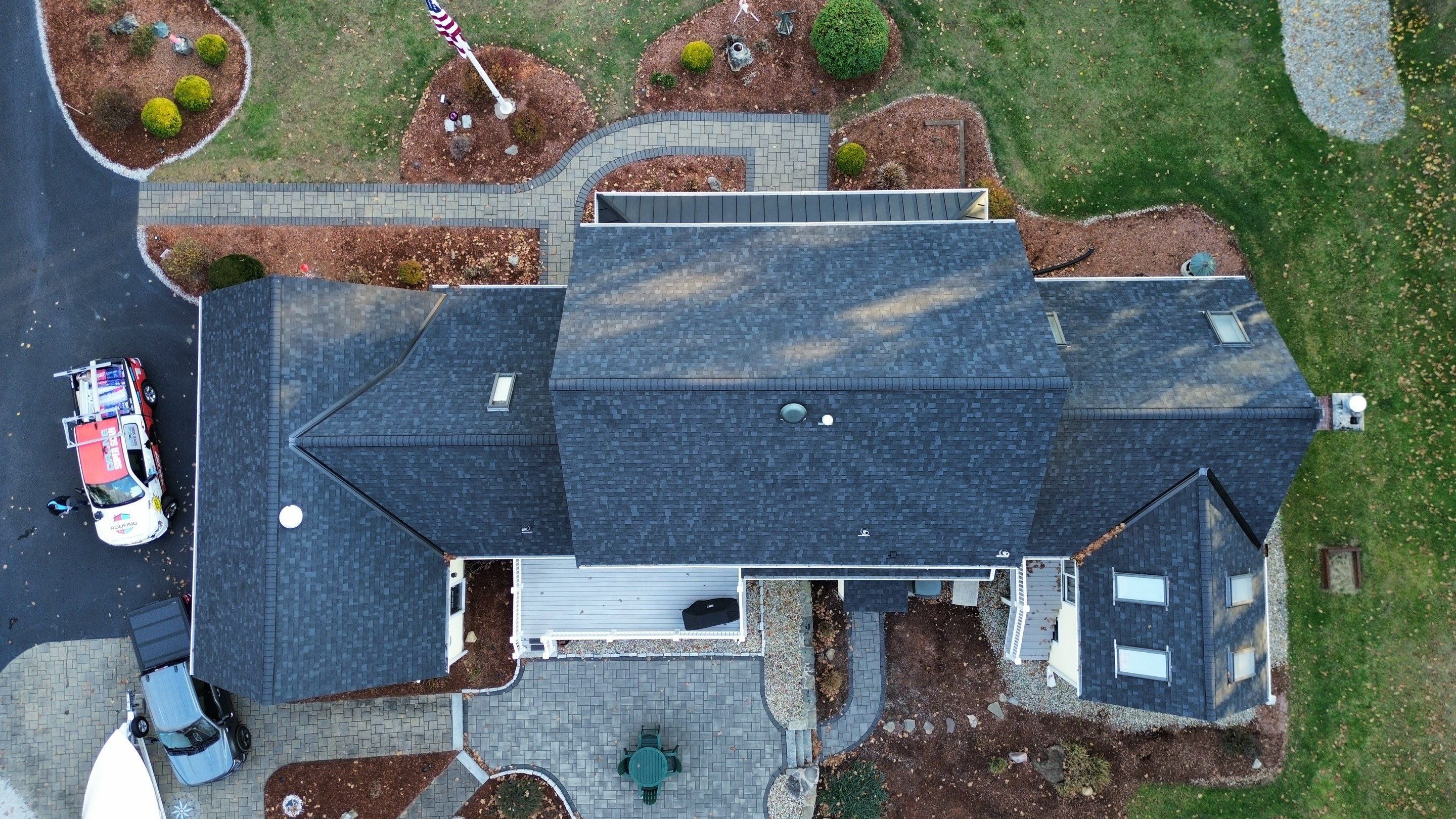 Chelmsford Premium Roof: Onyx Black Shingles with Standing Seam Metal Porch by Mighty Dog Roofing of Greater Middlesex County