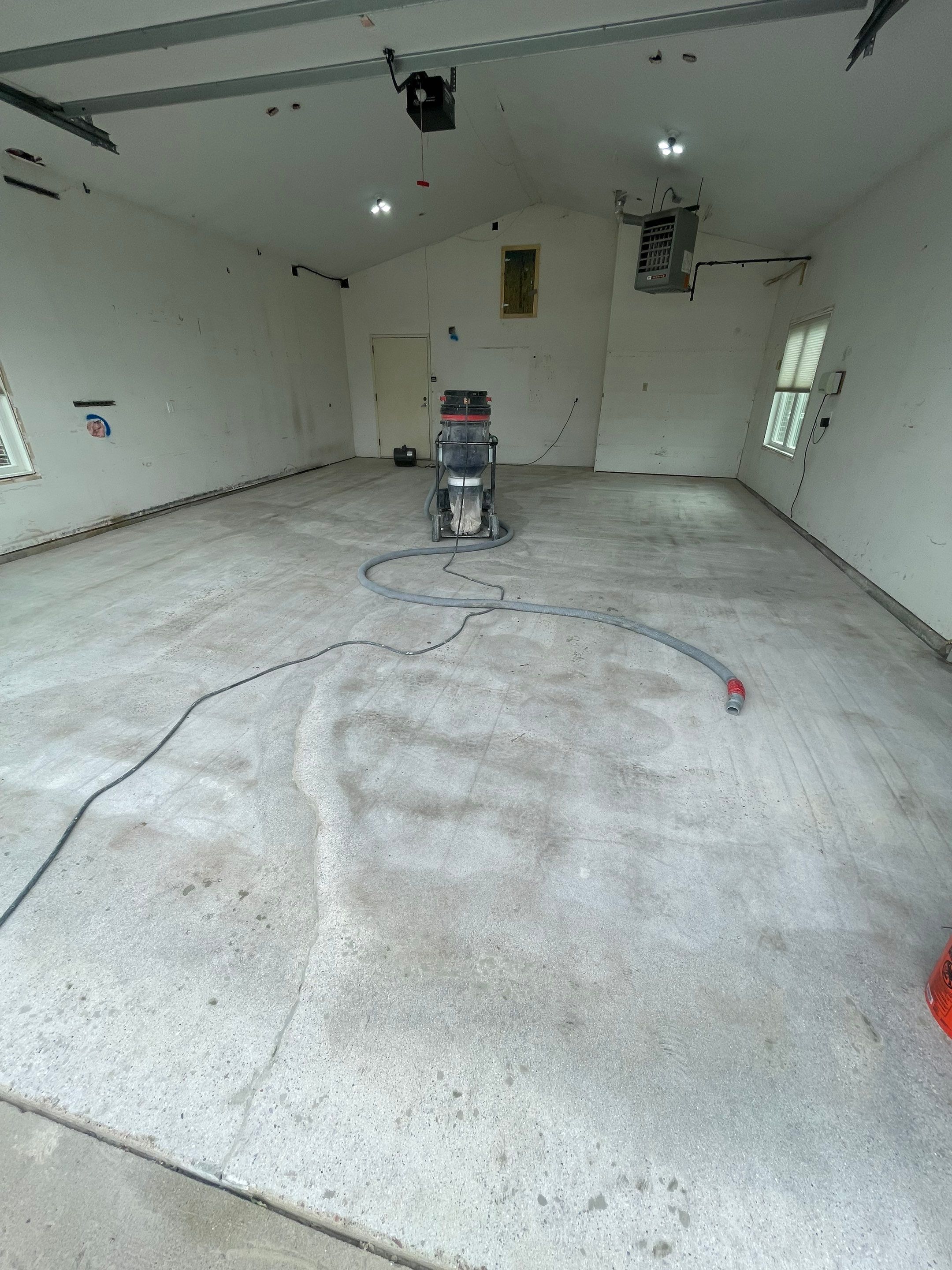Coyote Flake Concrete Coating for Sioux Falls Garage by Select Painting, Coatings & Garage Cabinets