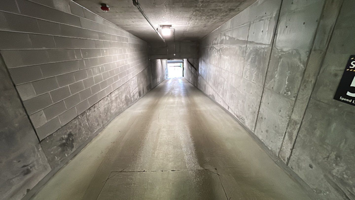 Parking garage using Hot water by Northern Power Washing LLC.
