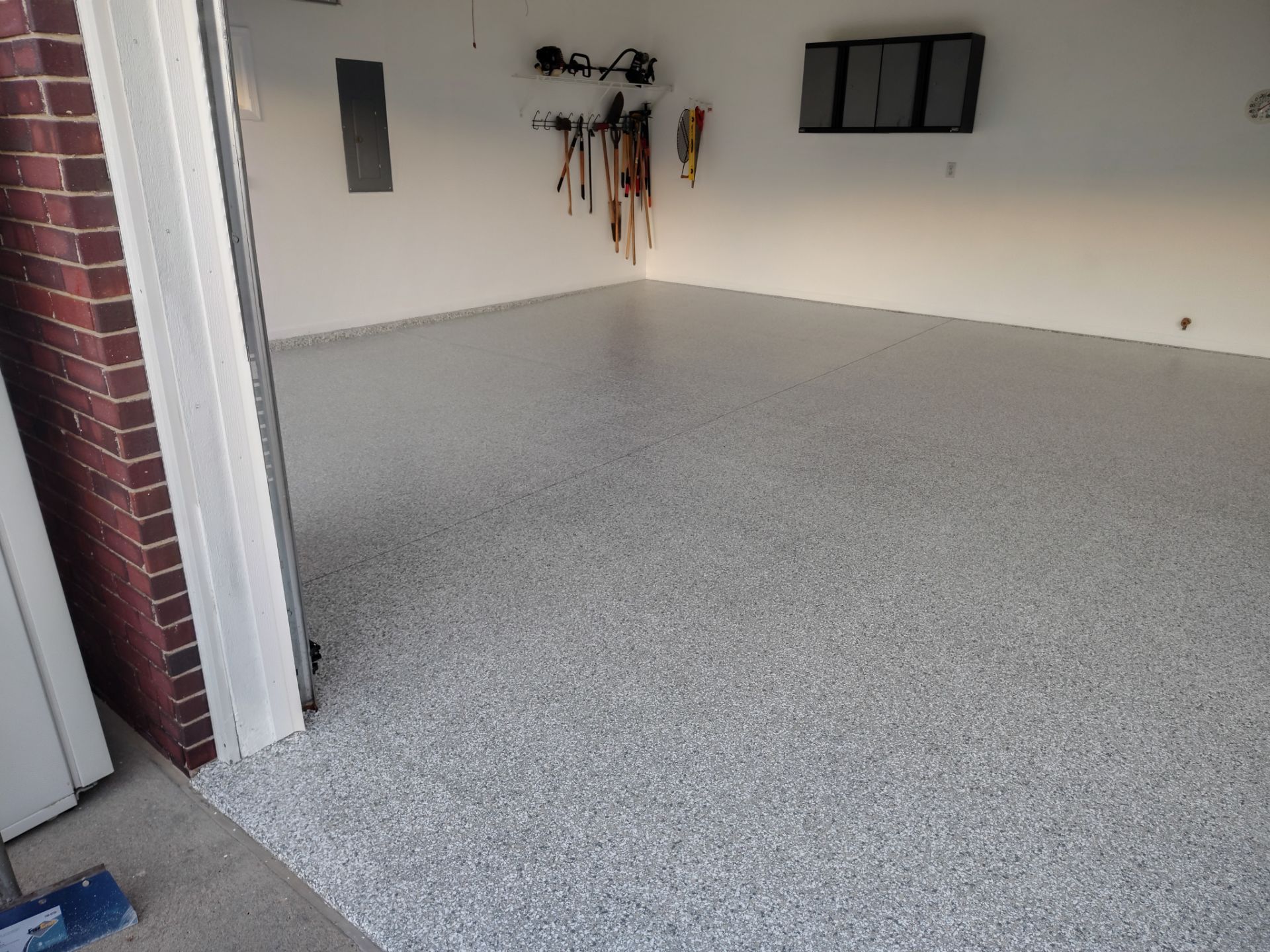 New Johnston Garage Resurfacing by Revival Concrete Coatings, LLC