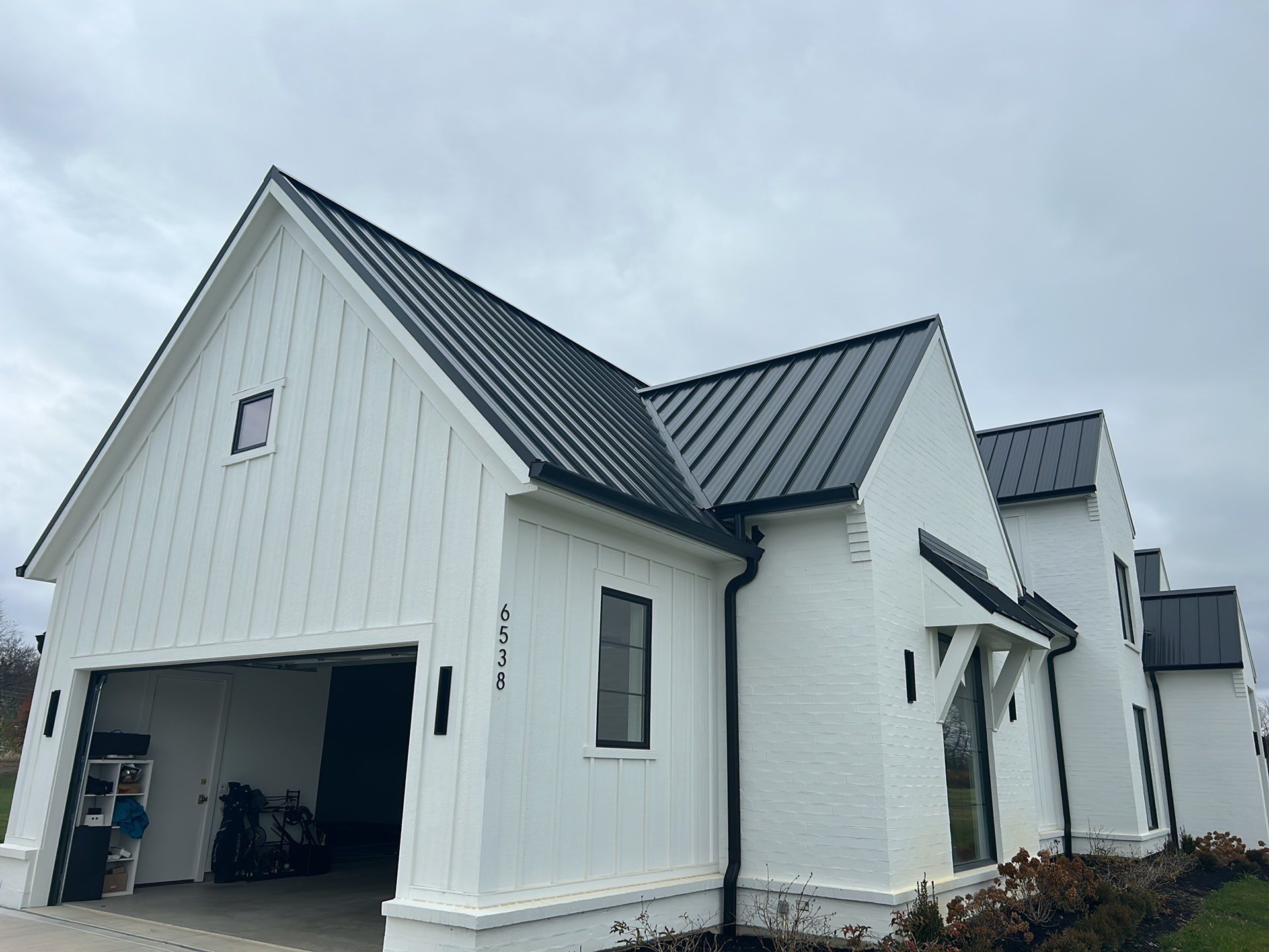 Residential Roofing Installation using Standing Seam Metal - Frost Black by RoofX 