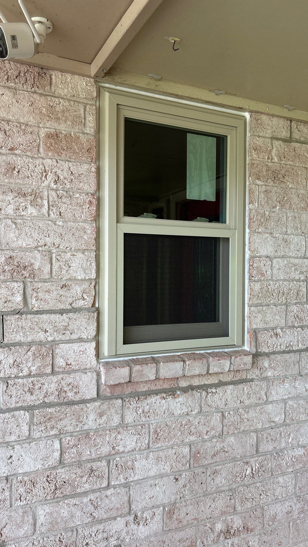Colored Vinyl Windows to blend into brick by Bayfront Roofing and Construction