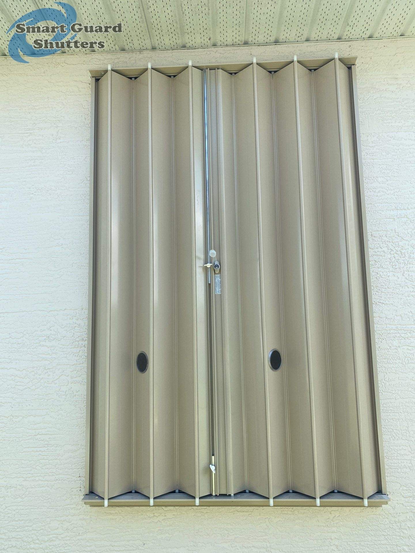 Accordion Shutters in Beige  by Smart Guard Shutters