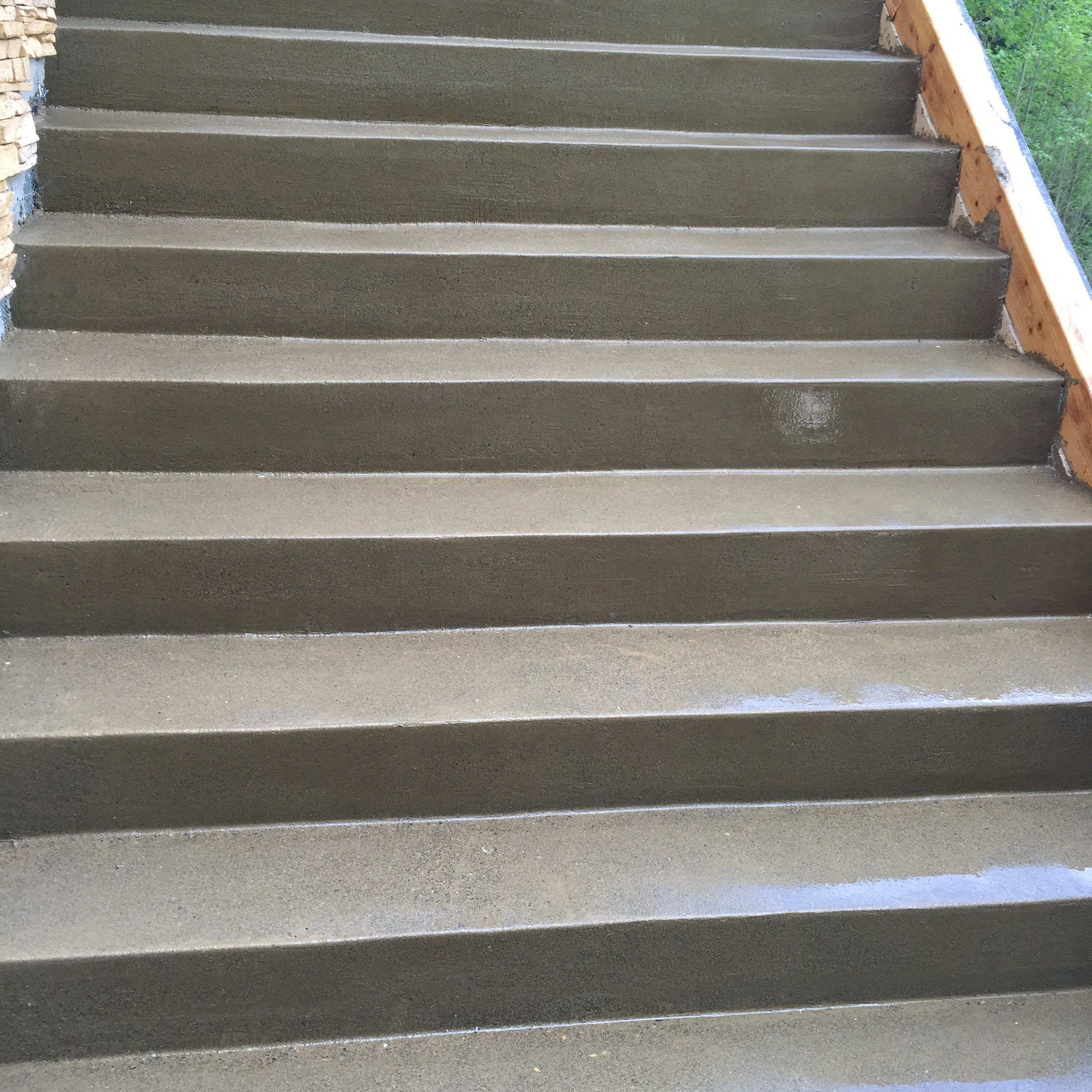 Asphalt Driveway and Stamped Concrete Patio Finish  by Jireh Asphalt & Concrete Inc 