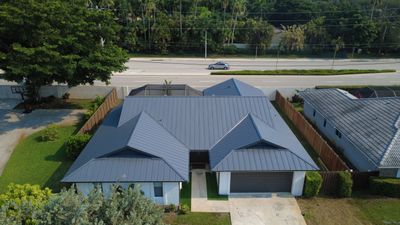 Residential Roofing Installation using 1" Nail strip metal roof