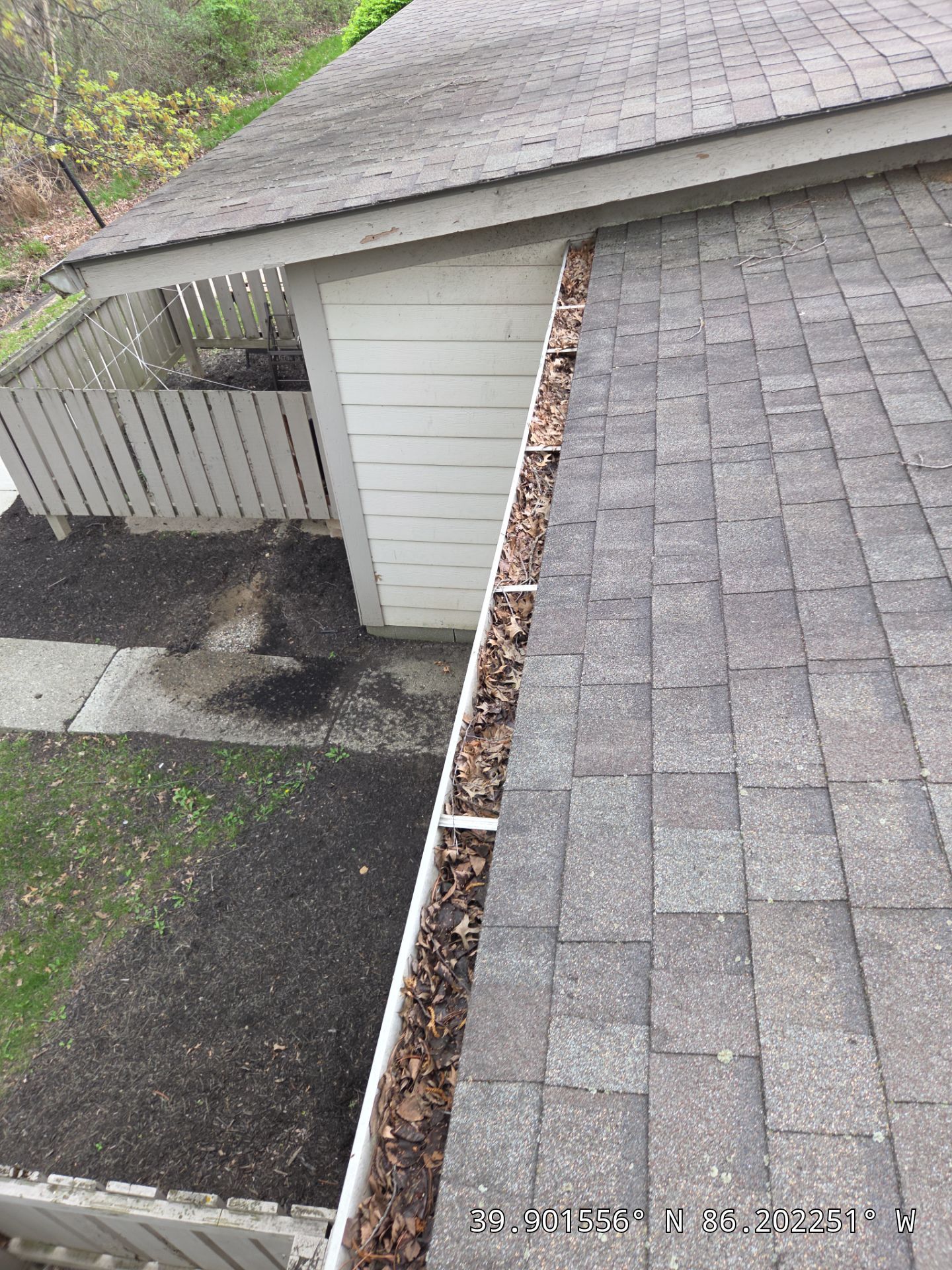 Commercial gutter cleaning Indianapolis before photo with filled gutters