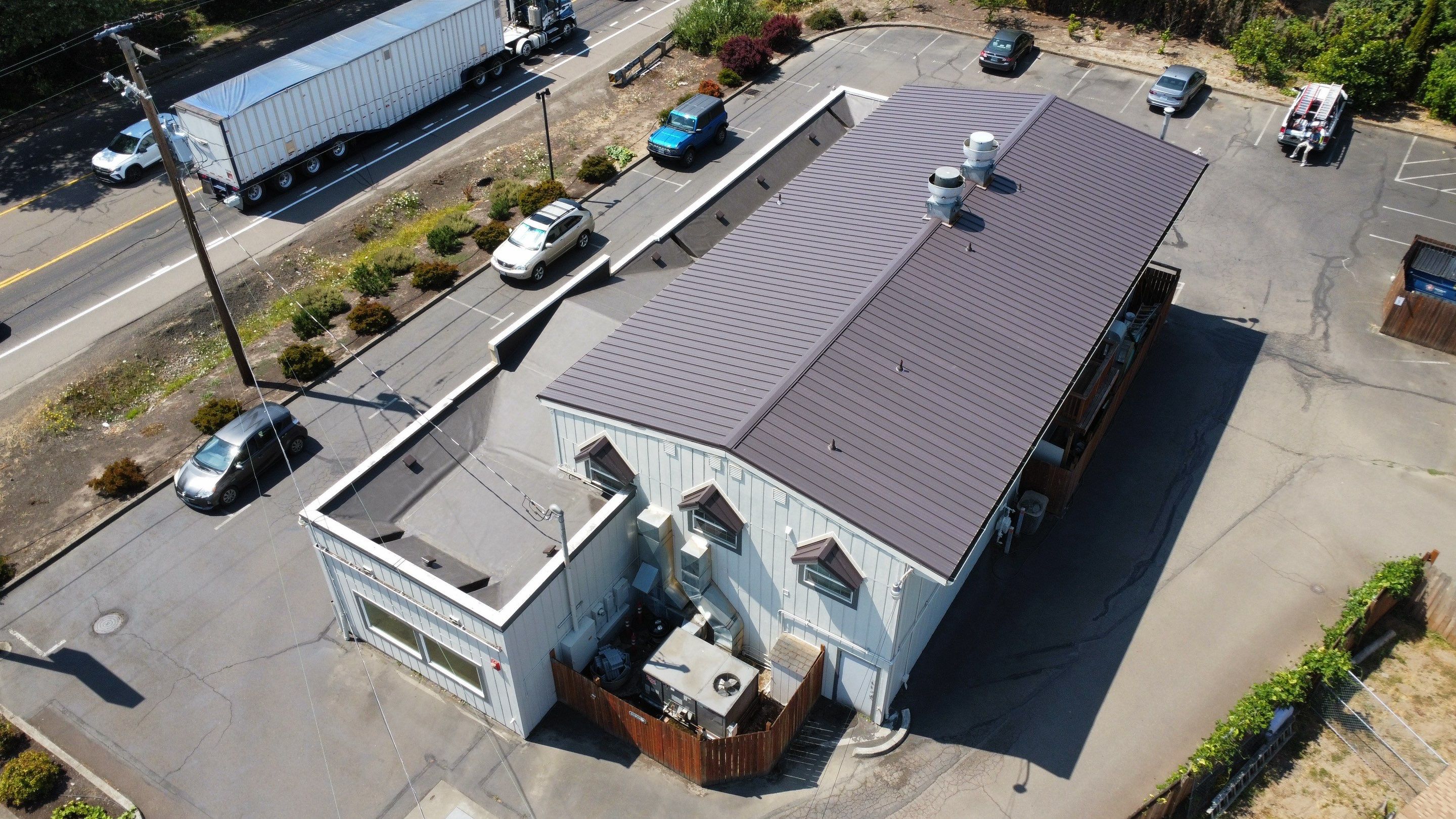 Commercial Flat Roof Installation using Bruce and Dana Snap Lock Metal (Color: Brown) by Orezona Building & Roofing Company, Inc.