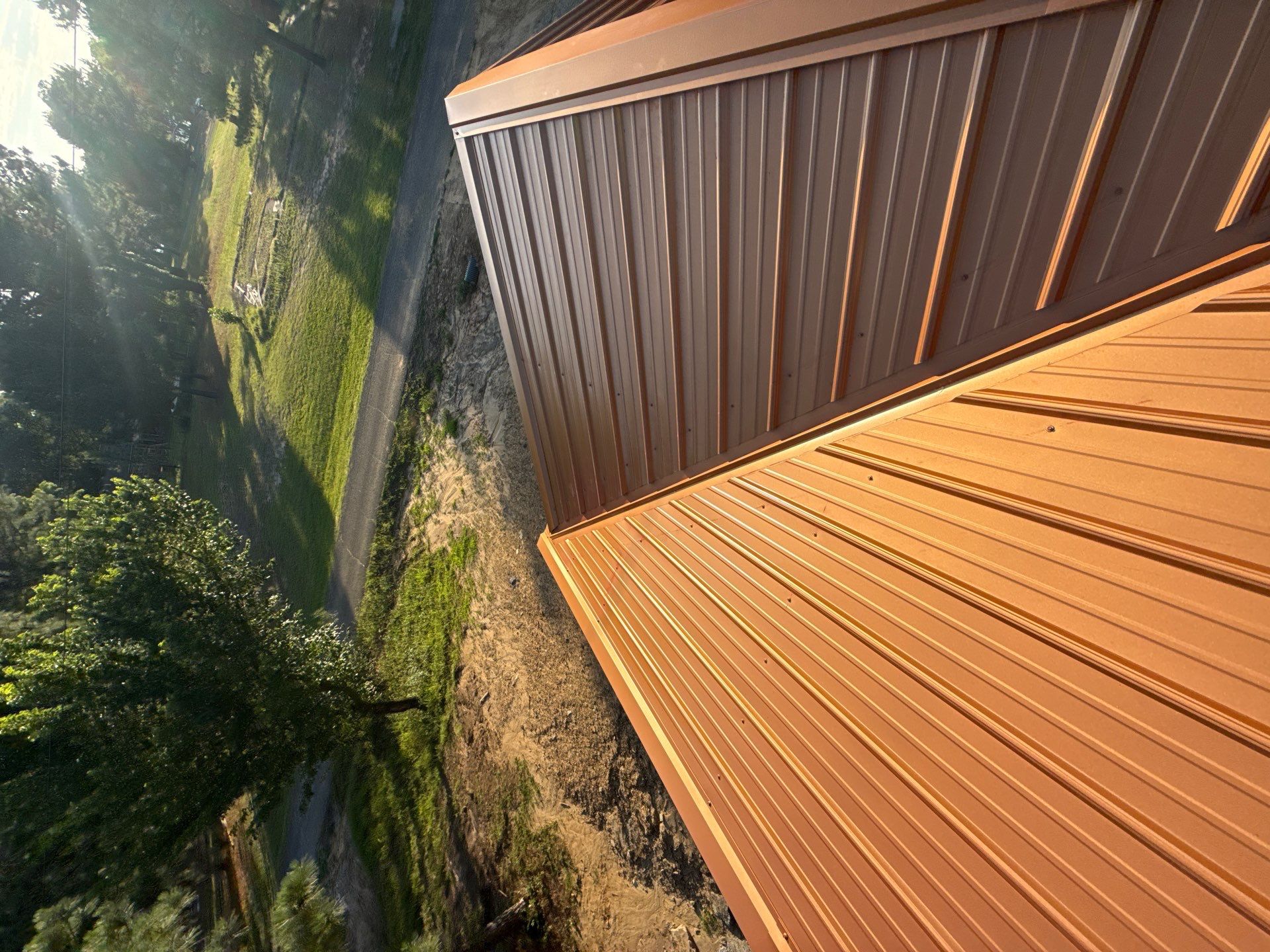 Copper Metallic 26-gauge low rib metal roofing. by In & Out Construction & Remodeling, LLC
