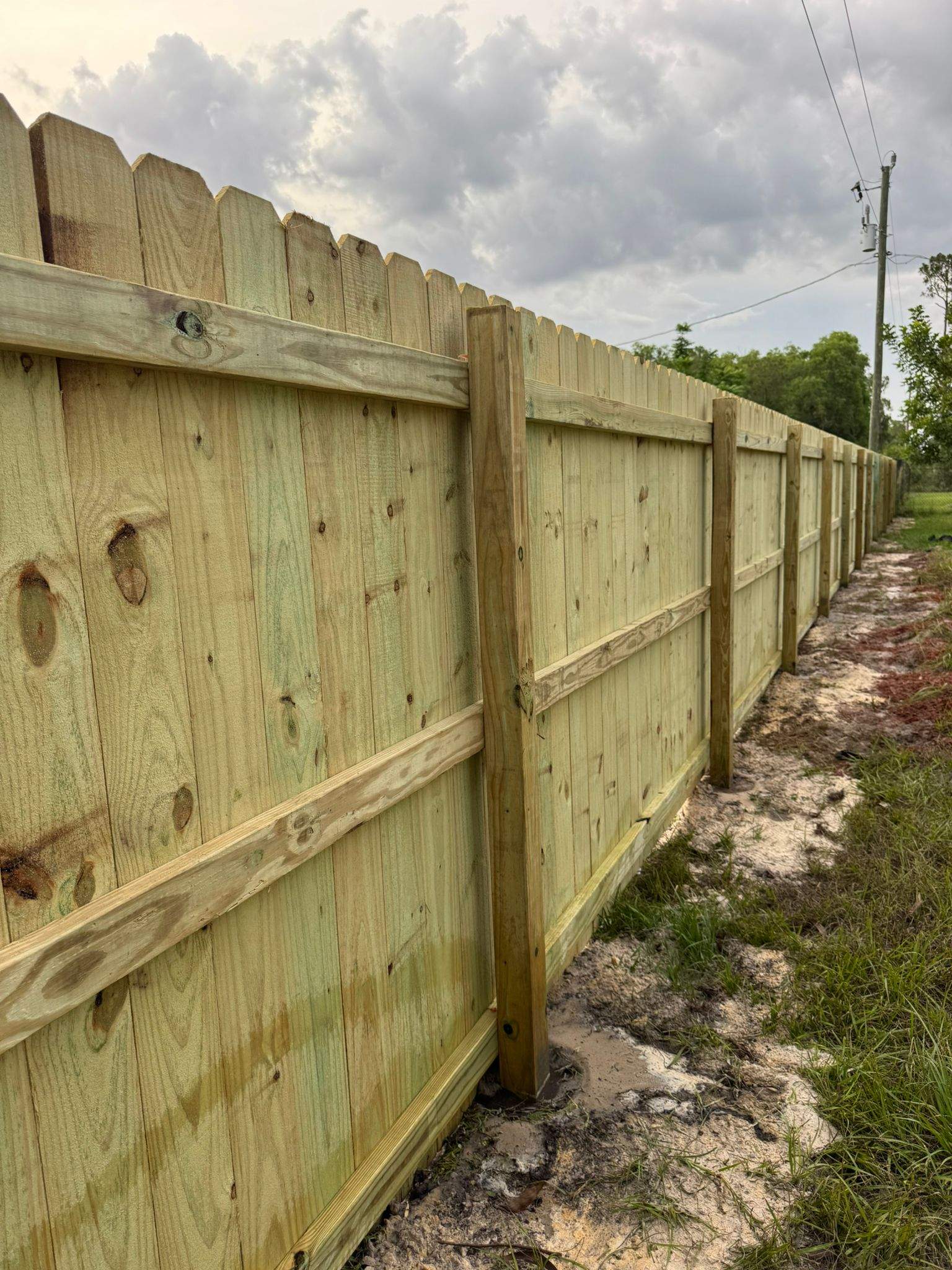 Pressure-Treated Wood Privacy Fence with Dog-Ear Pickets in Lehigh Acres by True Fence LLC