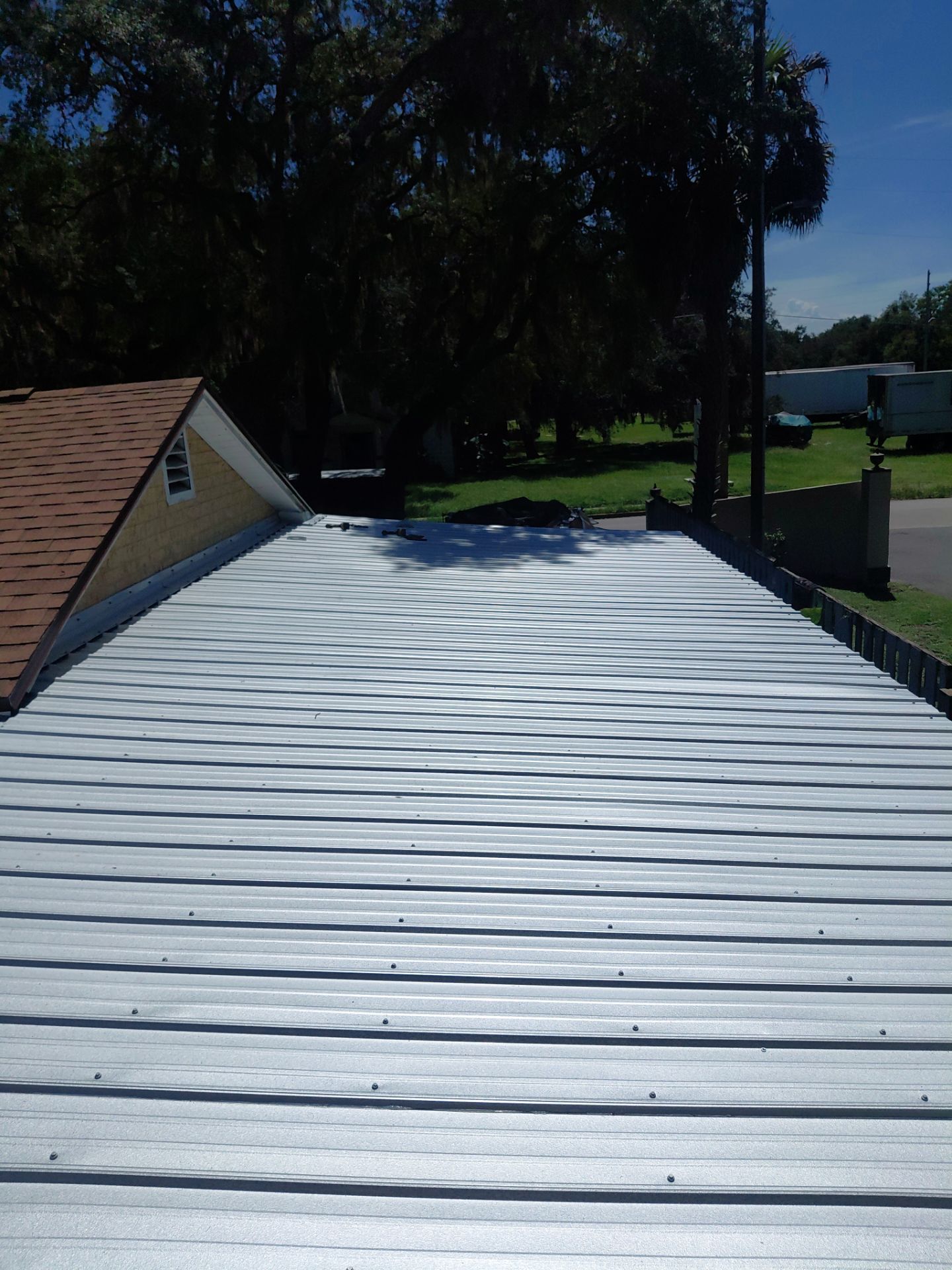 Combined Shingle and Metal Residential Roof Replacement in Leesburg Florida by Pinnacle Roofing Group
