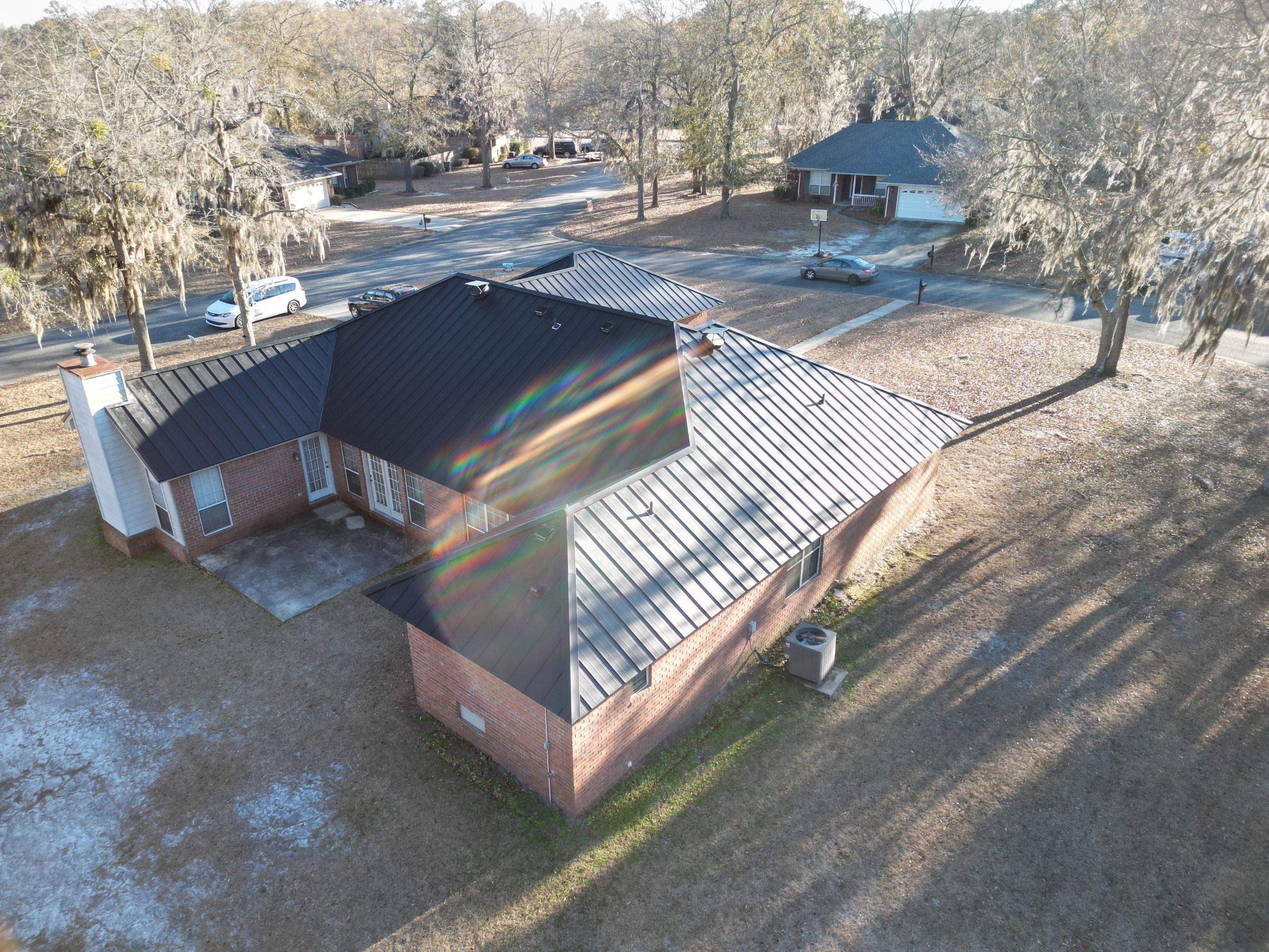 Residential Roofing Installation using Benton 26Ga 1inc Snapcock Metal Roof KYNAR Matte Black by Talya Roofing