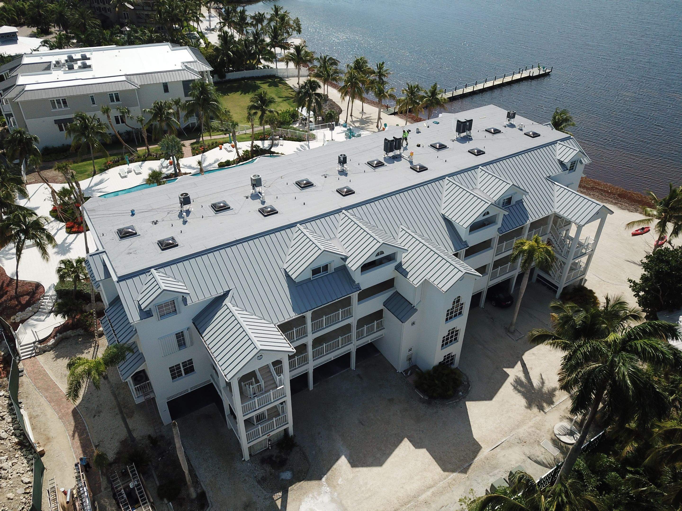 Pac-Clad 040 Aluminum Standing Seam metal roof and GAF hot mopped Modified with tapered Iso insulation  by BOB HILSON & CO INC