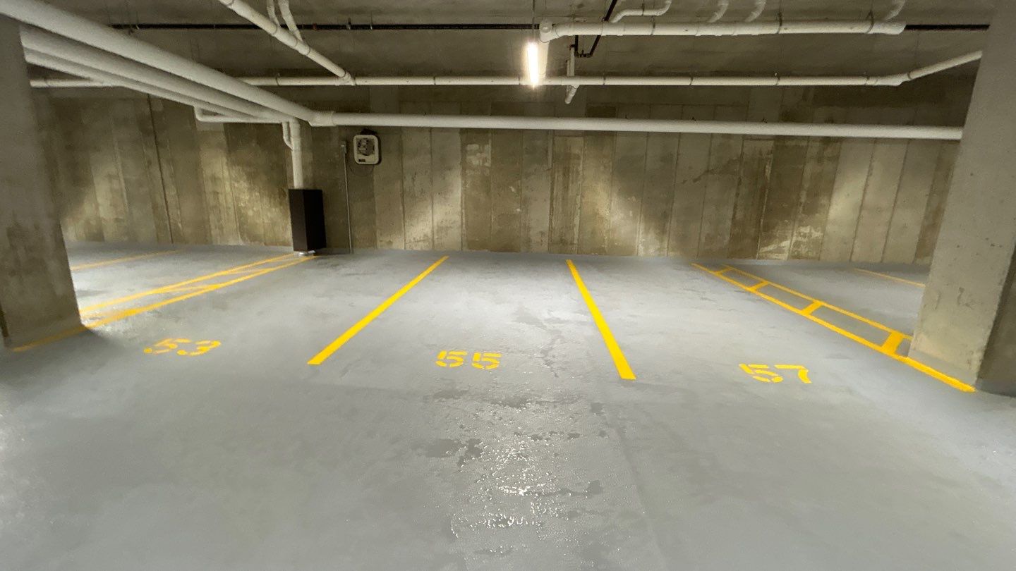 Parking garage using Hot water by Northern Power Washing LLC.