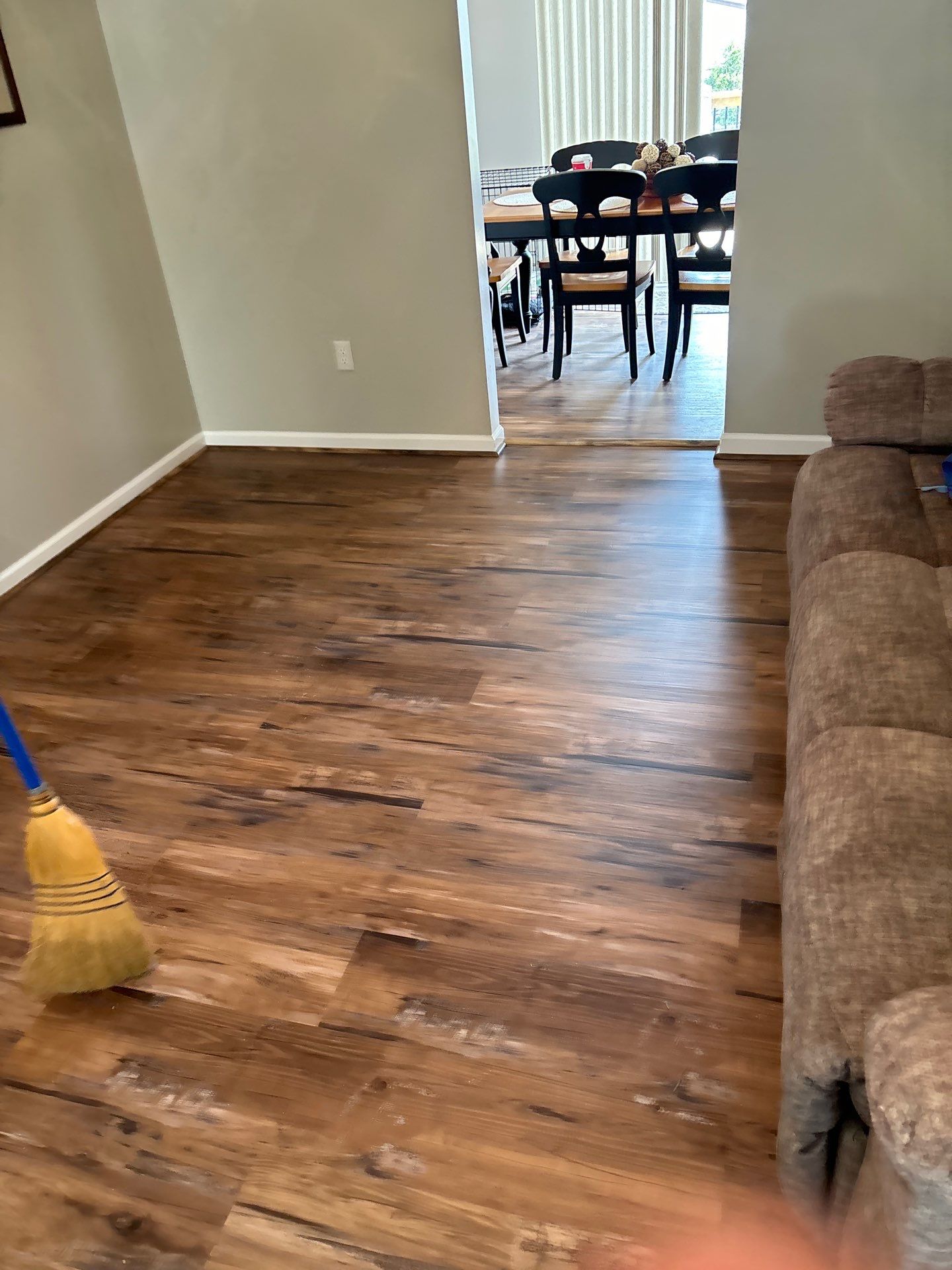 Living room LVP Flooring install  by Laser Focused Solutions LLC