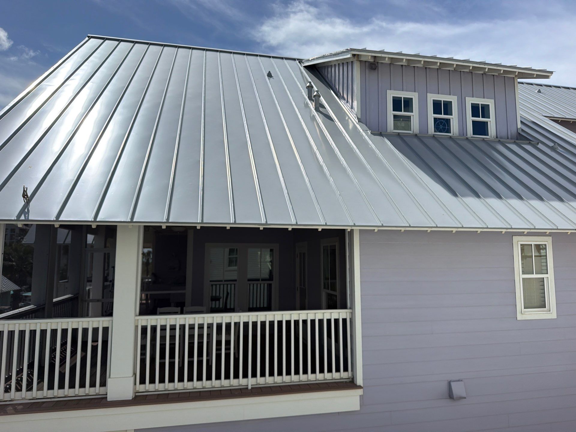 Residential Roof Replacement using .032 Standing Seam Doublelock - Aluminum by Action Exteriors Austin