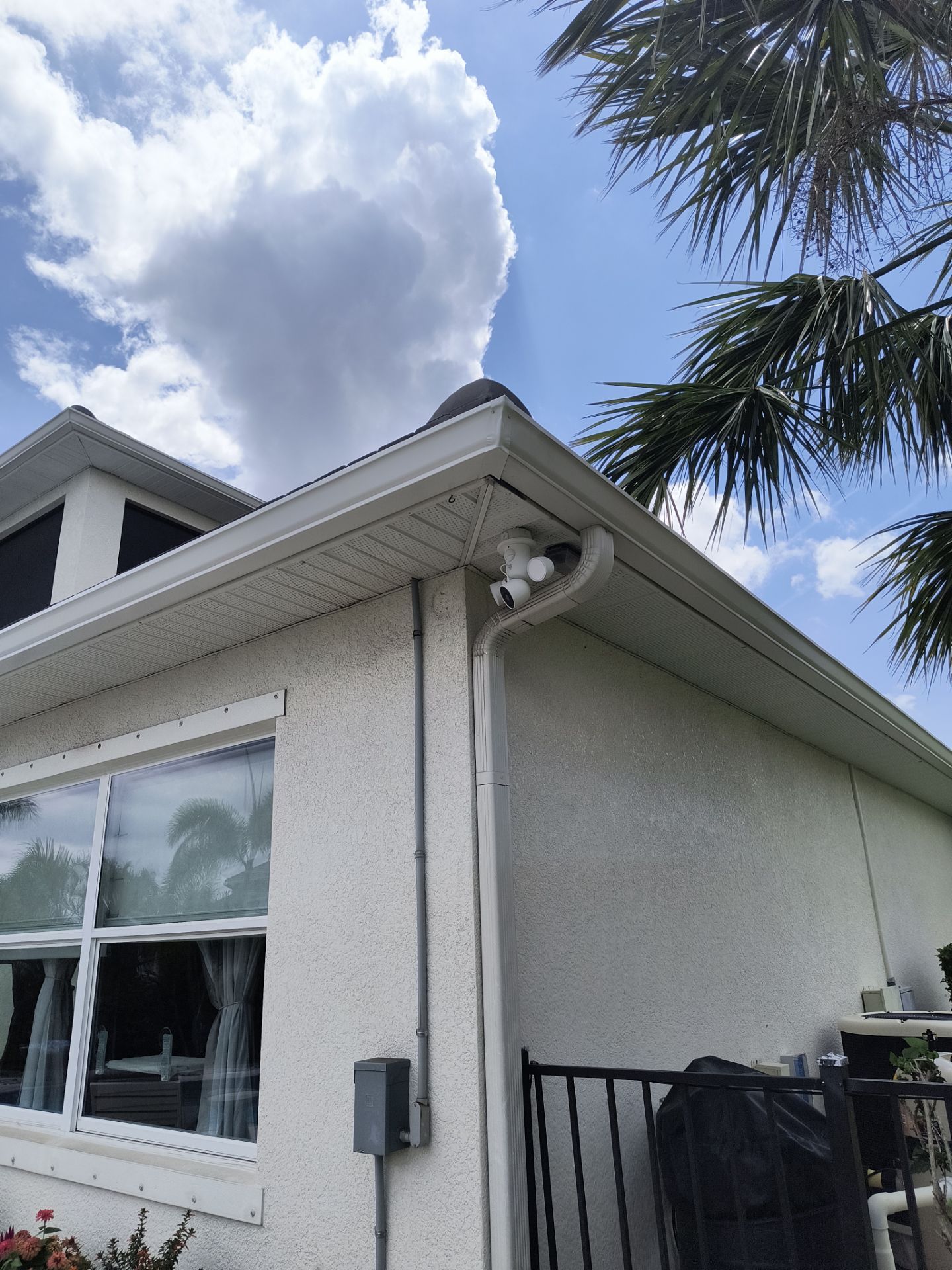 White Seamless Gutters with Downspouts in Bradenton FL by Gutter Professors