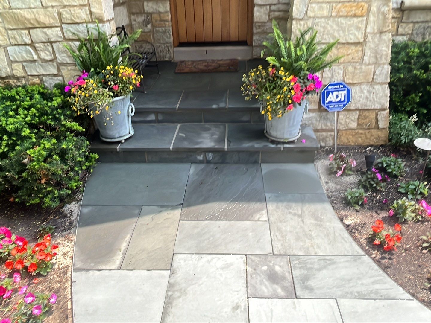 Northbrook, IL stucco home soft wash and stone cleaning by Northern Power Washing LLC.
