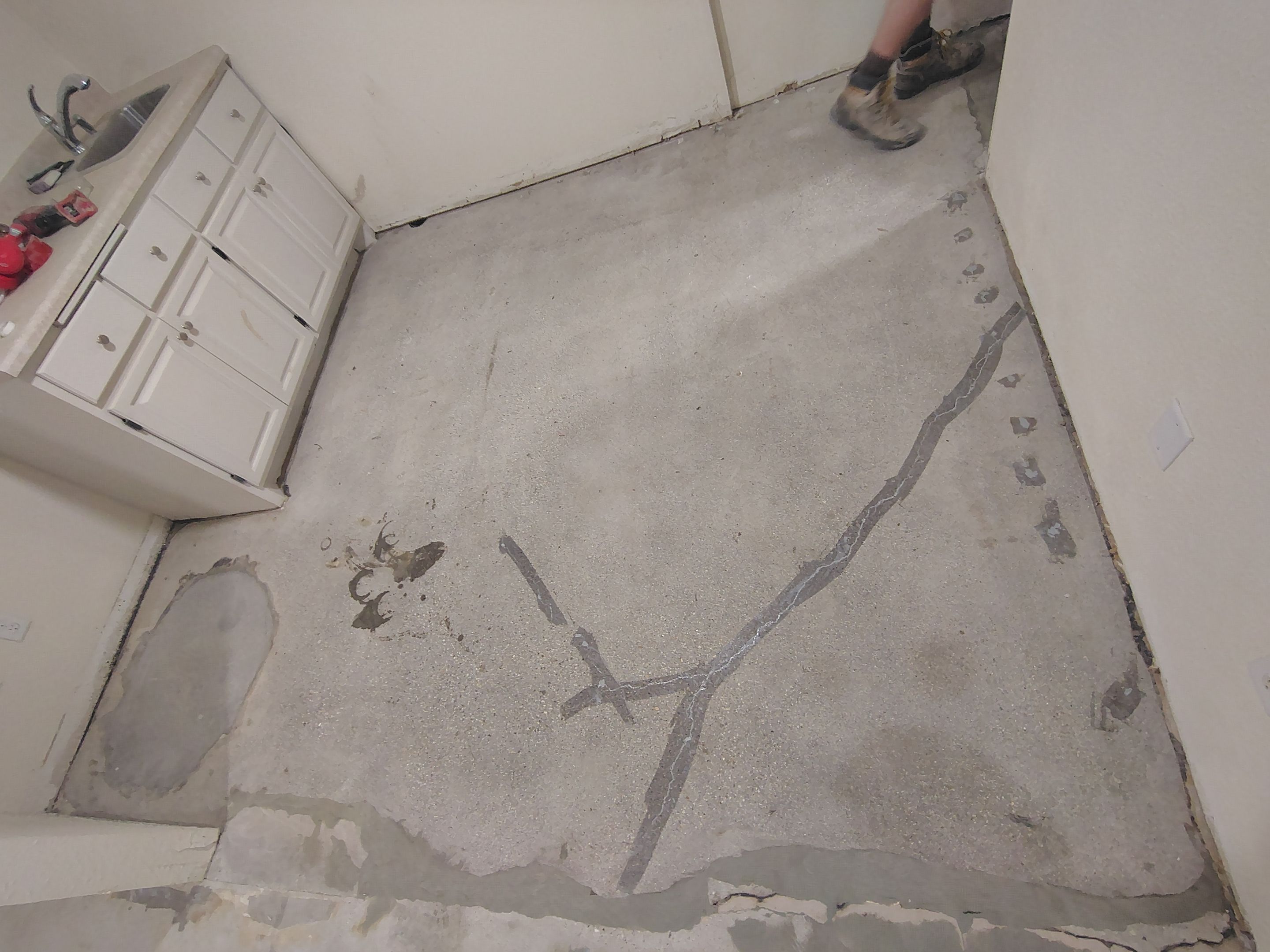Comprehensive Basement Concrete Floor Coating and Crack Repair in Sioux Falls by Select Painting, Coatings & Garage Cabinets