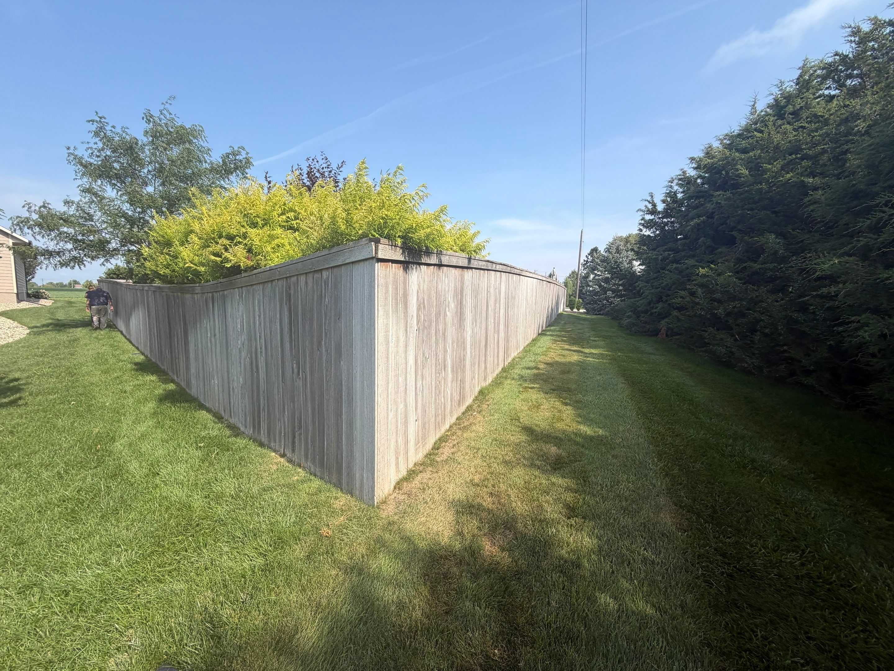 Custom Privacy Fence and Paver Patio Installation in Sioux Falls by Select Painting, Coatings & Garage Cabinets