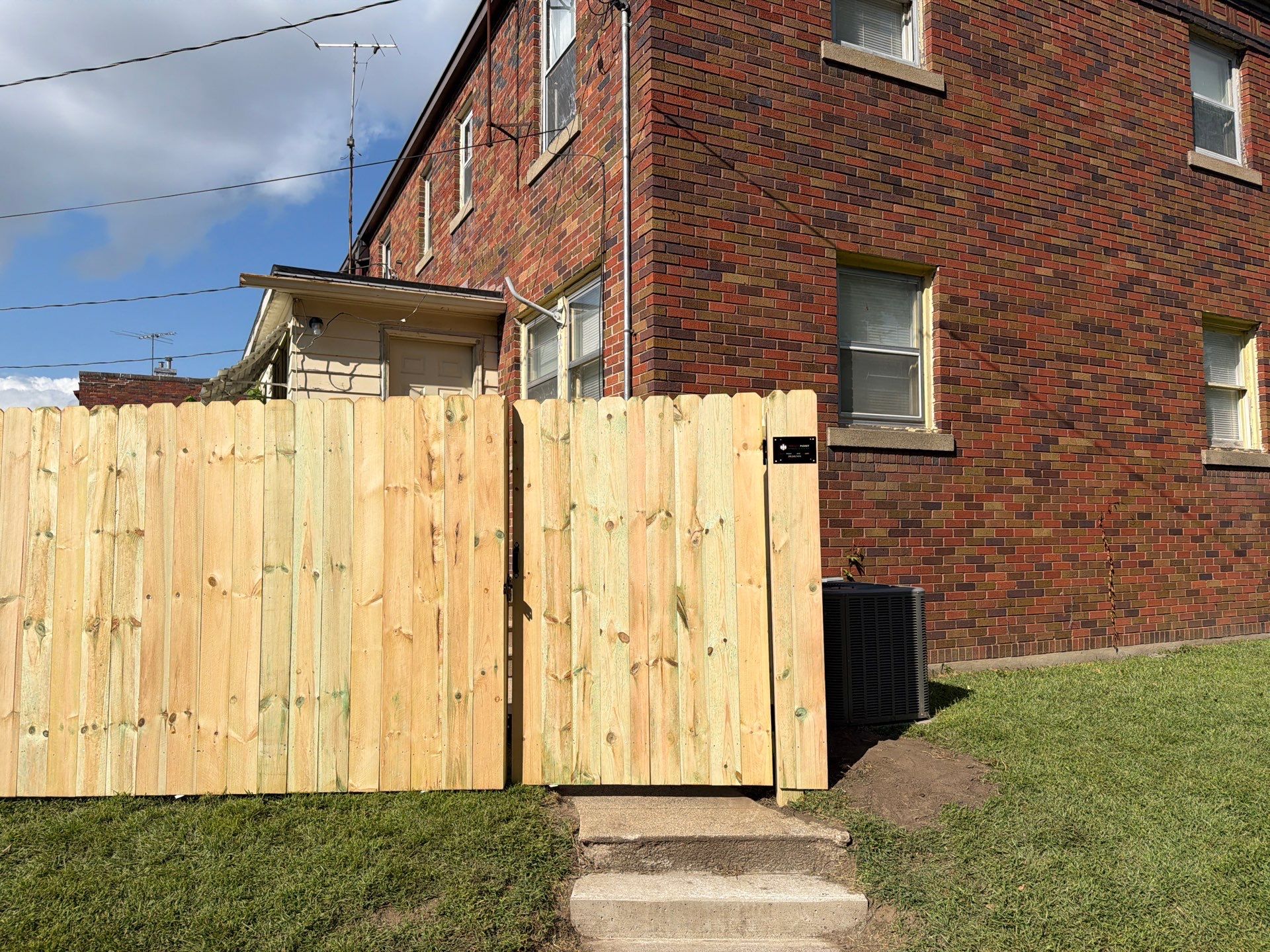 New Treated Wood Privacy Fence and Metal-Framed Gates by Perfect Picket Fence and Stain