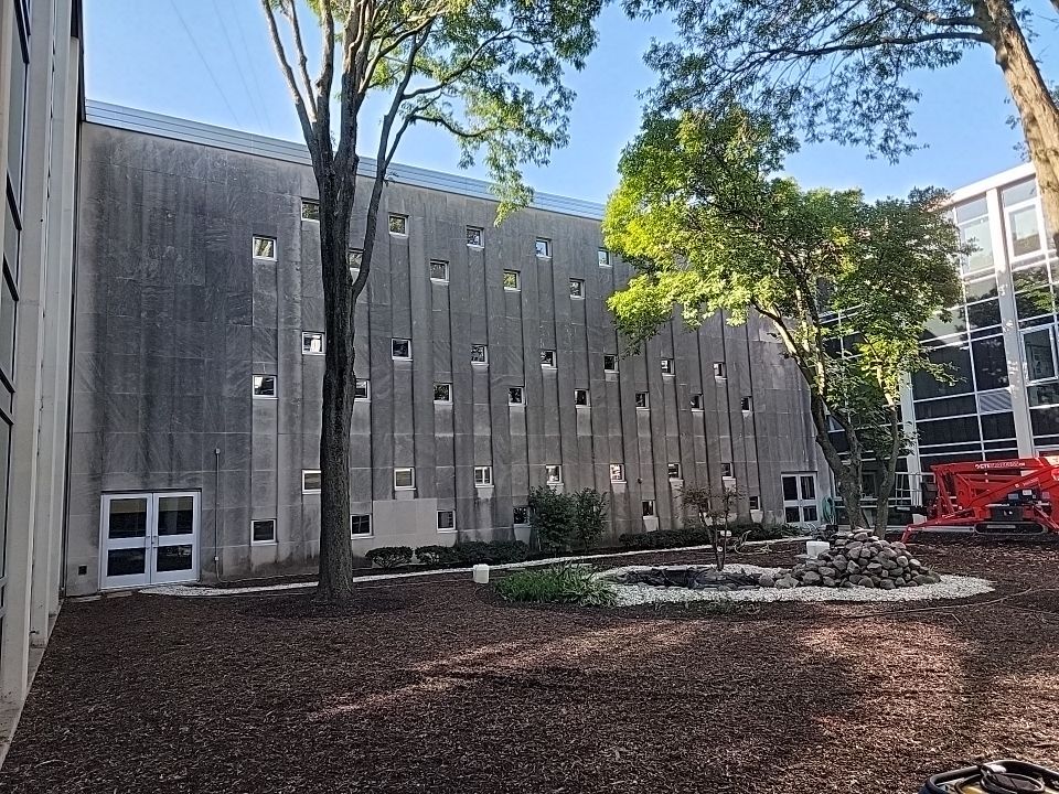 Courtyard pressure washing difficult access.  by Northern Power Washing LLC.