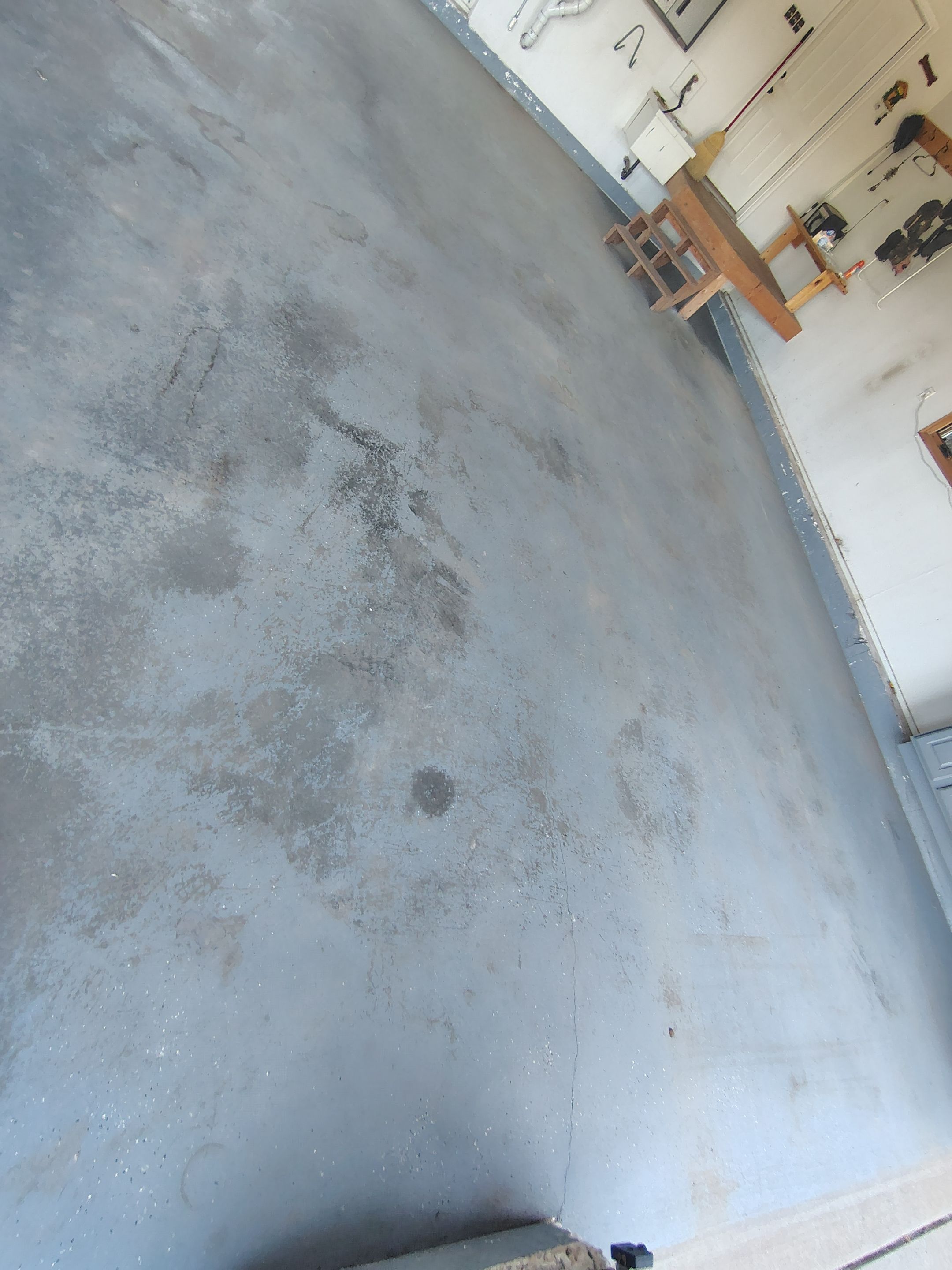 Feather Grey Garage Floor Coating Installation in Valley Springs by Select Painting, Coatings & Garage Cabinets