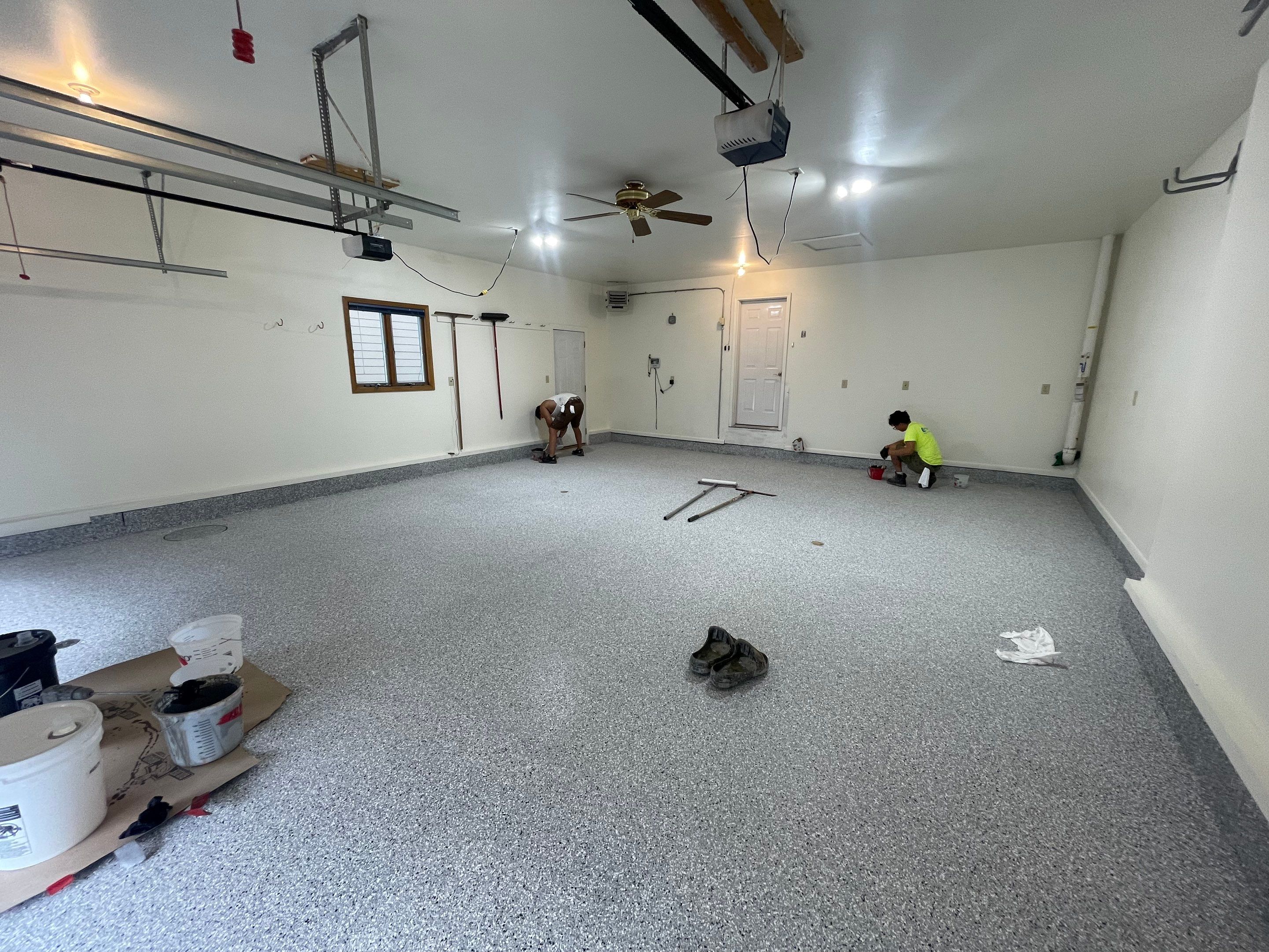Madison Garage Concrete Coating with Feather Grey Speckle Finish by Select Painting, Coatings & Garage Cabinets